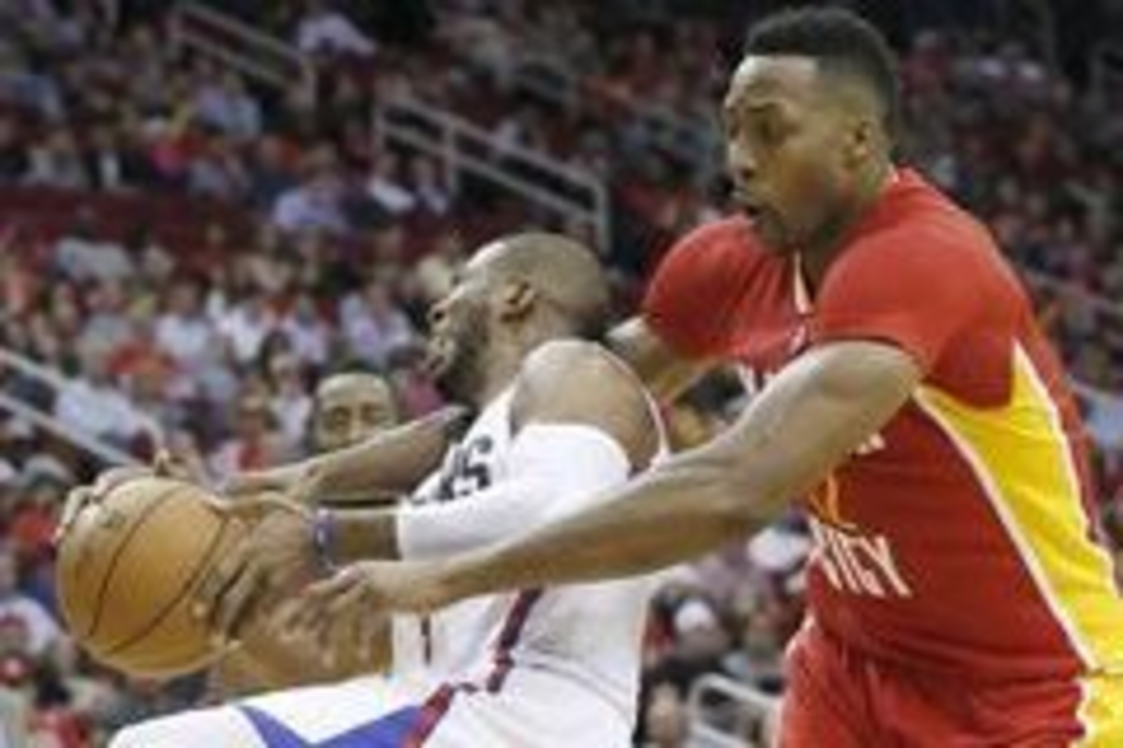 Mar 16, 2016; Houston, TX, USA; Los Angeles Clippers guard Chris Paul (3) is fouled by Houston Rockets center Dwight Howard (12) in the second half at Toyota Center. The Clippers won 122-106. Mandatory Credit: Thomas B. Shea-USA TODAY Sports