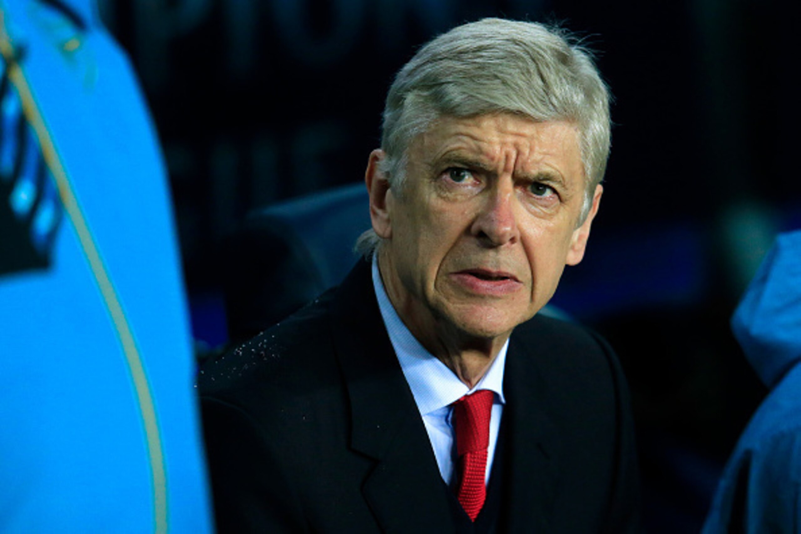 Arsenal's French coach Arsene Wenger looks on as he sits on his bench before the UEFA Champions League Round of 16 second leg football match FC Barcelona vs Arsenal FC at the Camp Nou stadium in Barcelona on March 16, 2016.  / AFP / PAU BARRENA        (Ph