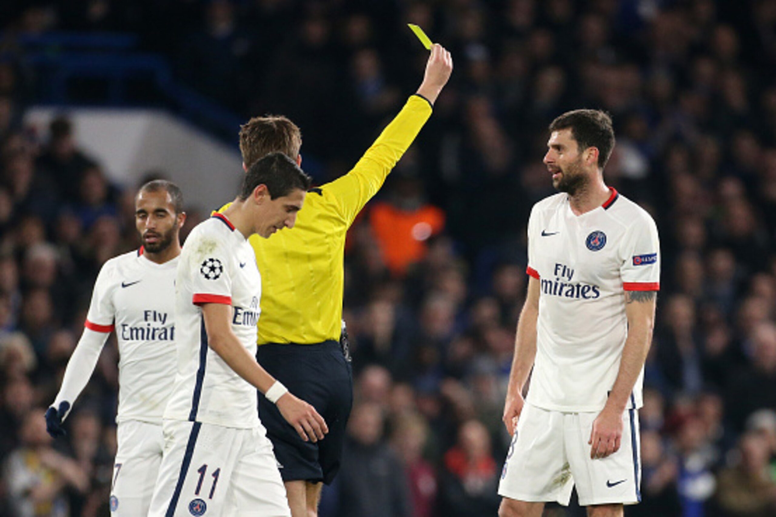 LONDON, ENGLAND - MARCH 9: Thiago Motta of PSG receives a yellow from referee Felix Brych during the UEFA Champions League round of 16 second leg match between Chelsea FC and Paris Saint-Germain at Stamford Bridge stadium on March 9, 2016 in London, Engla