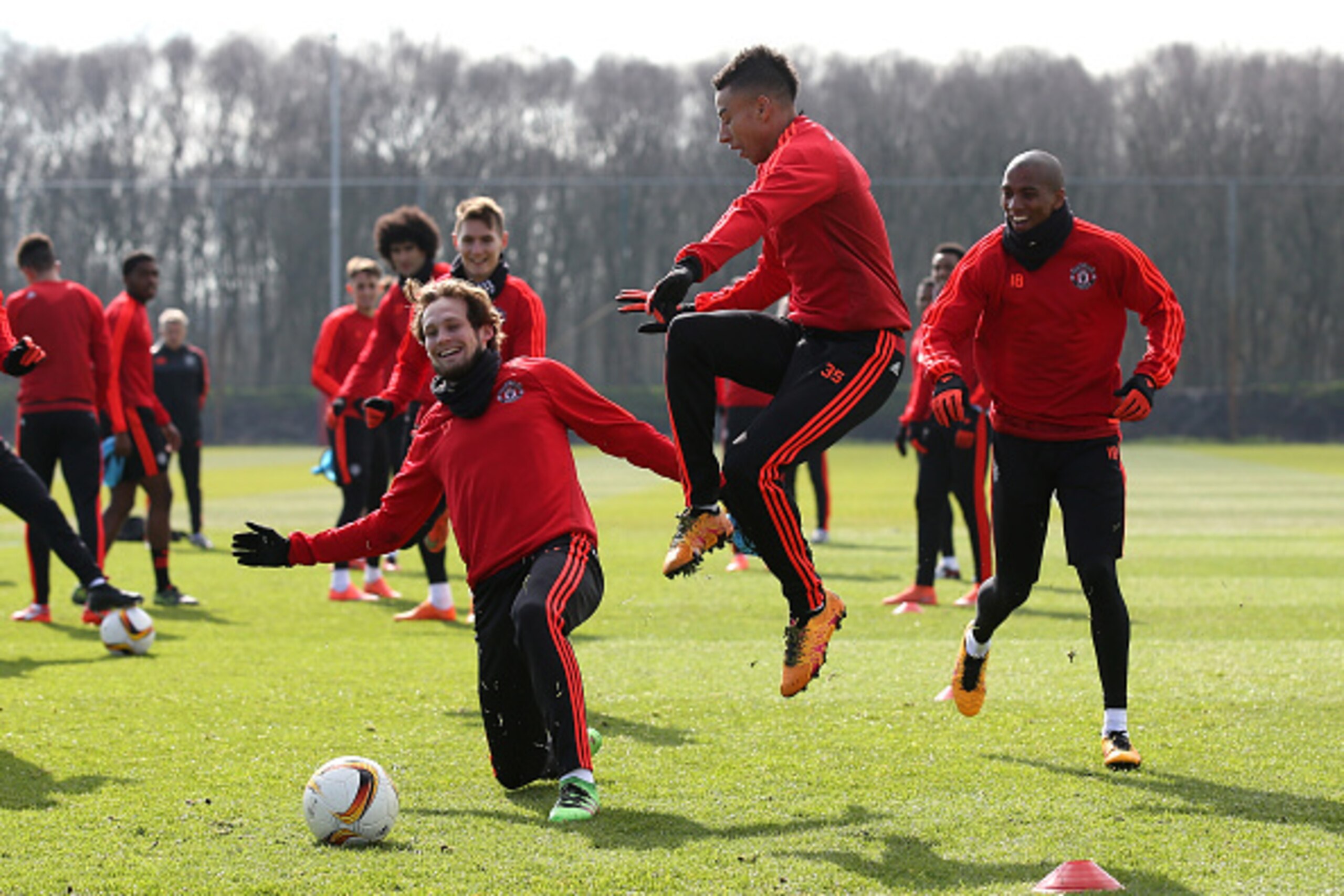 MANCHESTER, ENGLAND - MARCH 16:  Daley Blind of Manchester United and Jesse Lingard of Manchester United compete for the ball during a training session ahead of the UEFA Europa League round of 16 second leg match between Manchester United and Liverpool at
