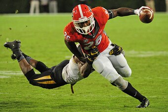 ATHENS, GA - OCTOBER 17: Malcolm Mitchell #26 of the Georgia Bulldogs runs with a catch against Kenya Dennis #7 of the Missouri Tigers on October 17, 2015 in Atlanta, Georgia. Photo by Scott Cunningham/Getty Images)