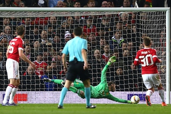 MANCHESTER, ENGLAND - MARCH 17:  Goalkeeper David De Gea of Manchester United stretches to make a save during the UEFA Europa League round of 16, second leg match between Manchester United and Liverpool at Old Trafford on March 17, 2016 in Manchester, Eng