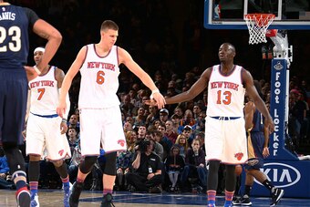 NEW YORK, NY - NOVEMBER 15: Kristaps Porzingis #6 high fives Jerian Grant #13 of the New York Knicks during the game against the New Orleans Pelicans on November 15, 2015 at Madison Square Garden in New York, New York. NOTE TO USER: User expressly acknowl