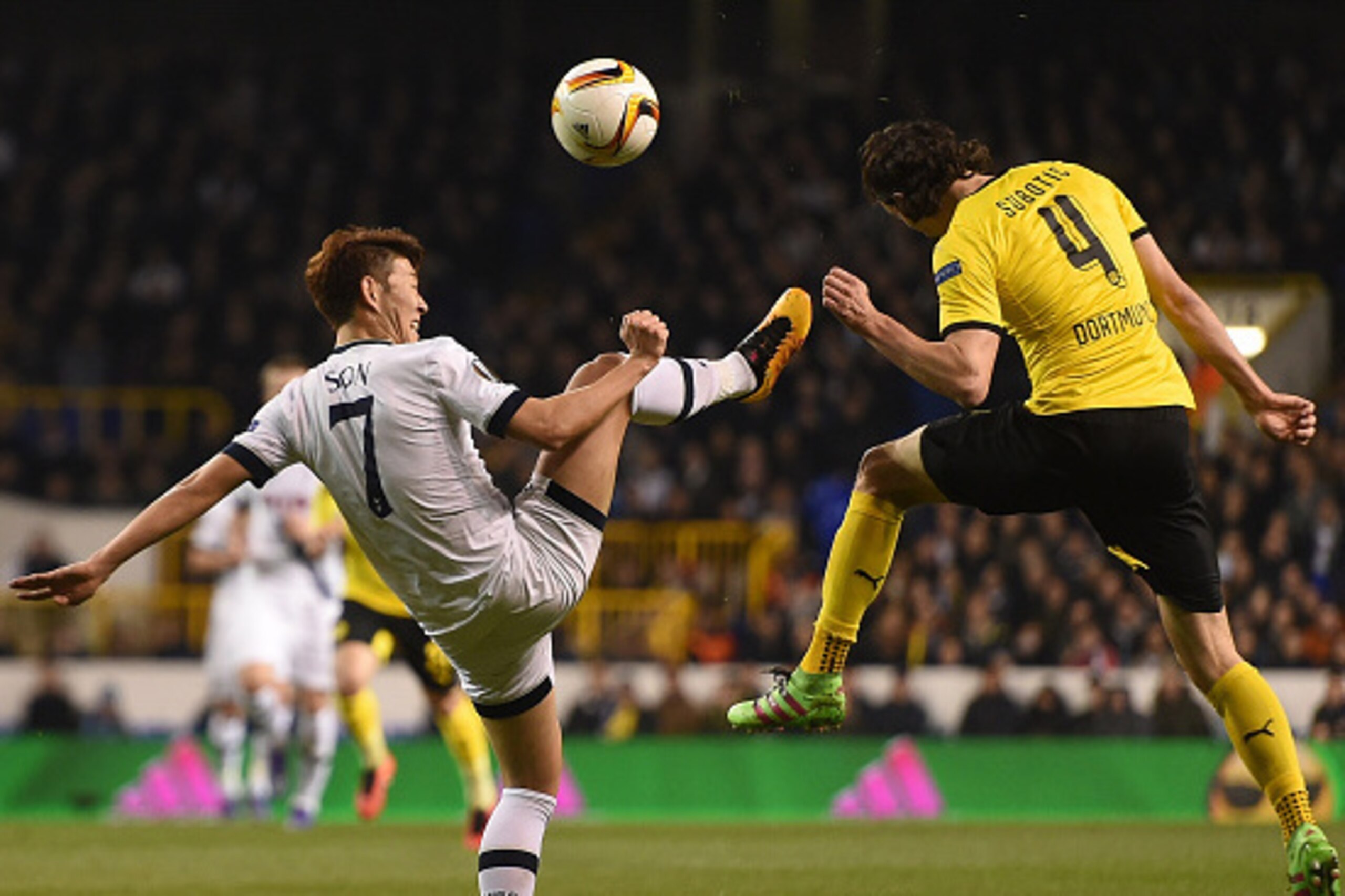LONDON, ENGLAND - MARCH 17:  Heung-Min Son of Tottenham Hotspur and Neven Subotic of Borussia Dortmund in action during the UEFA Europa League Round of 16 Second Leg match between Tottenham Hotspur and Borussia Dortmund at White Hart Lane on March 17, 201