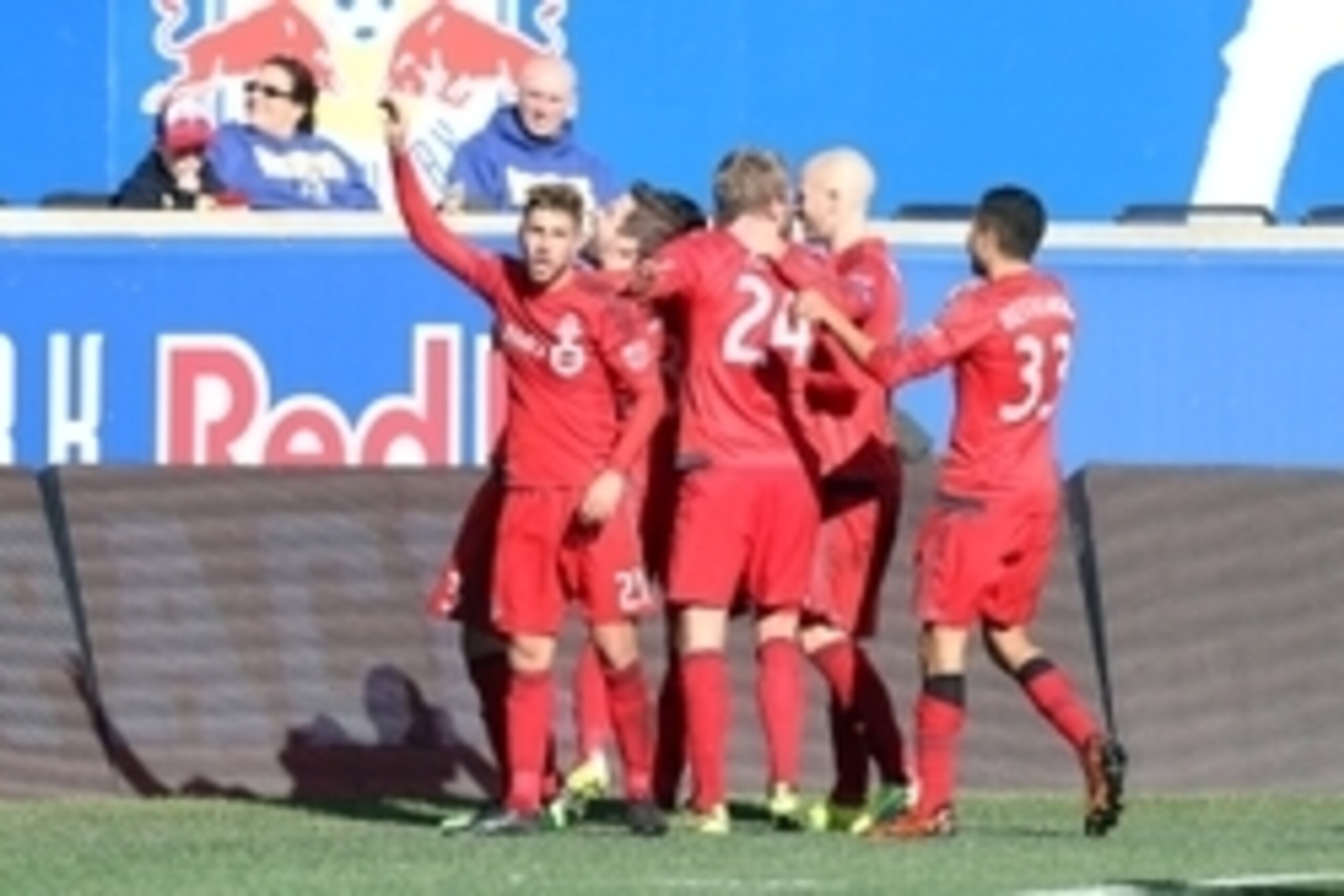 Mar 6, 2016; Harrison, NJ, USA; Toronto FC midfielder Jonathan Osorio (21) celebrates with teammates after their 2-0 opening day victory at Red Bull Arena. Mandatory Credit: Vincent Carchietta-USA TODAY Sports