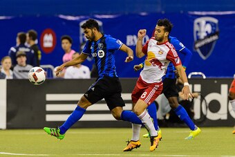 MONTREAL, QC - MARCH 12: Felipe Martins #8 of the New York Red Bulls challenges Victor Cabrera #36 of the Montreal Impact during the MLS game at the Olympic Stadium on March 12, 2016 in Montreal, Quebec, Canada. (Photo by Minas Panagiotakis/Getty Images)