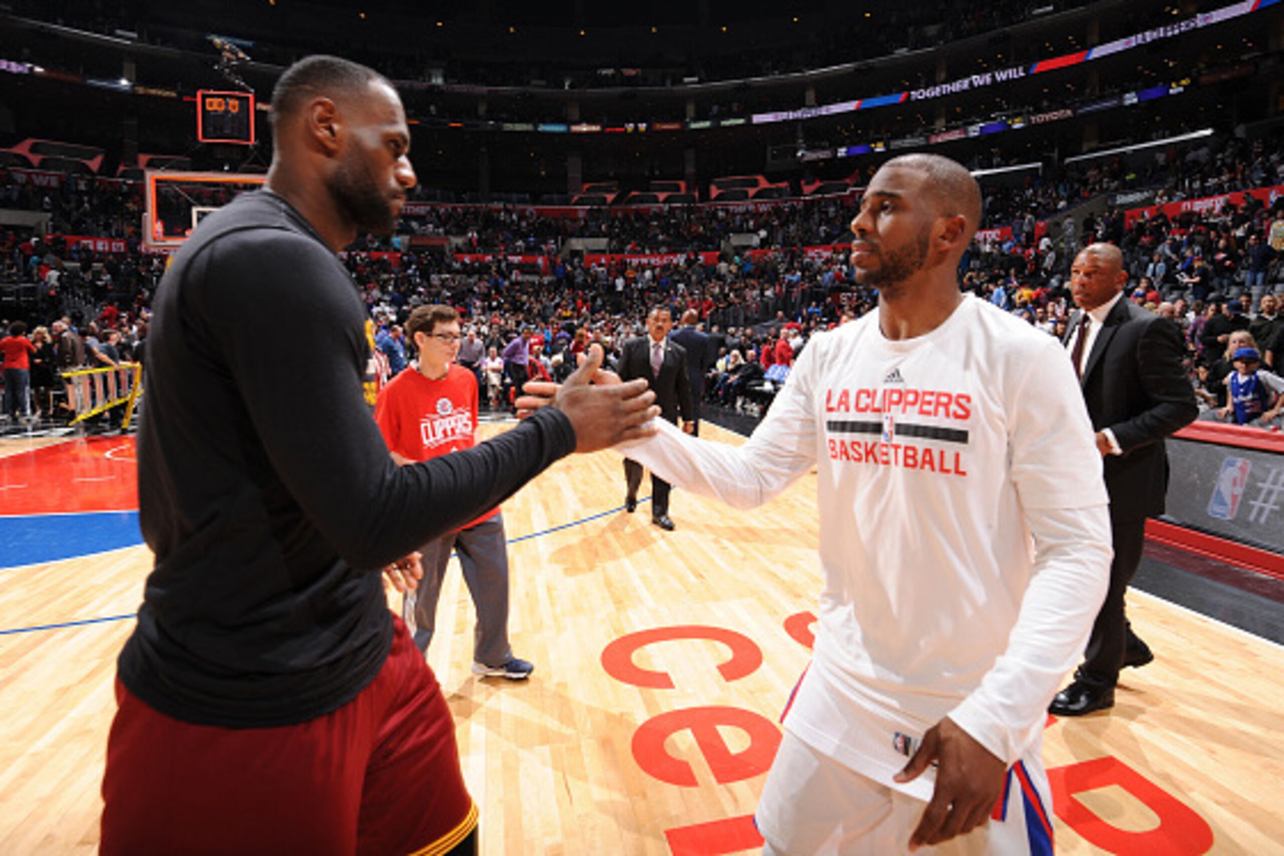 LOS ANGELES, CA  - MARCH 13: LeBron James #23 of the Cleveland Cavaliers hugs Chris Paul #3 of the Los Angeles Clippers after the game on March 13, 2016 at STAPLES Center in Los Angeles, California. NOTE TO USER: User expressly acknowledges and agrees tha