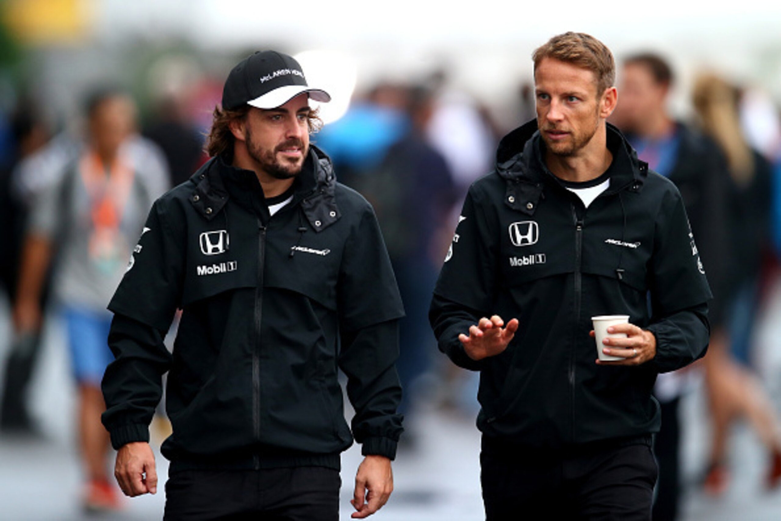 SUZUKA, JAPAN - SEPTEMBER 25:  Fernando Alonso of Spain and McLaren Honda and Jenson Button of Great Britain and McLaren Honda walk in the paddock during practice for the Formula One Grand Prix of Japan at Suzuka Circuit on September 25, 2015 in Suzuka.  