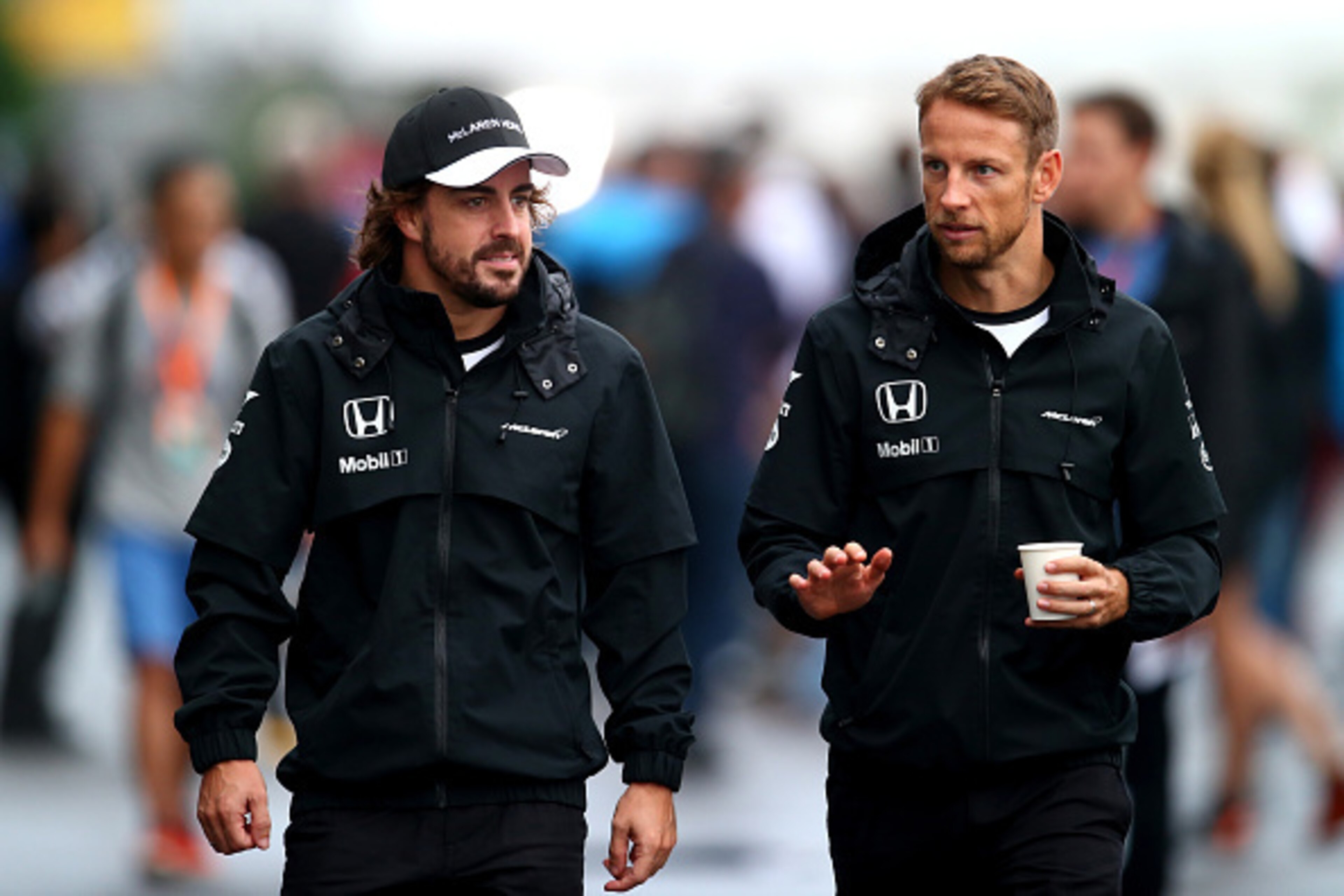 SUZUKA, JAPAN - SEPTEMBER 25:  Fernando Alonso of Spain and McLaren Honda and Jenson Button of Great Britain and McLaren Honda walk in the paddock during practice for the Formula One Grand Prix of Japan at Suzuka Circuit on September 25, 2015 in Suzuka.  