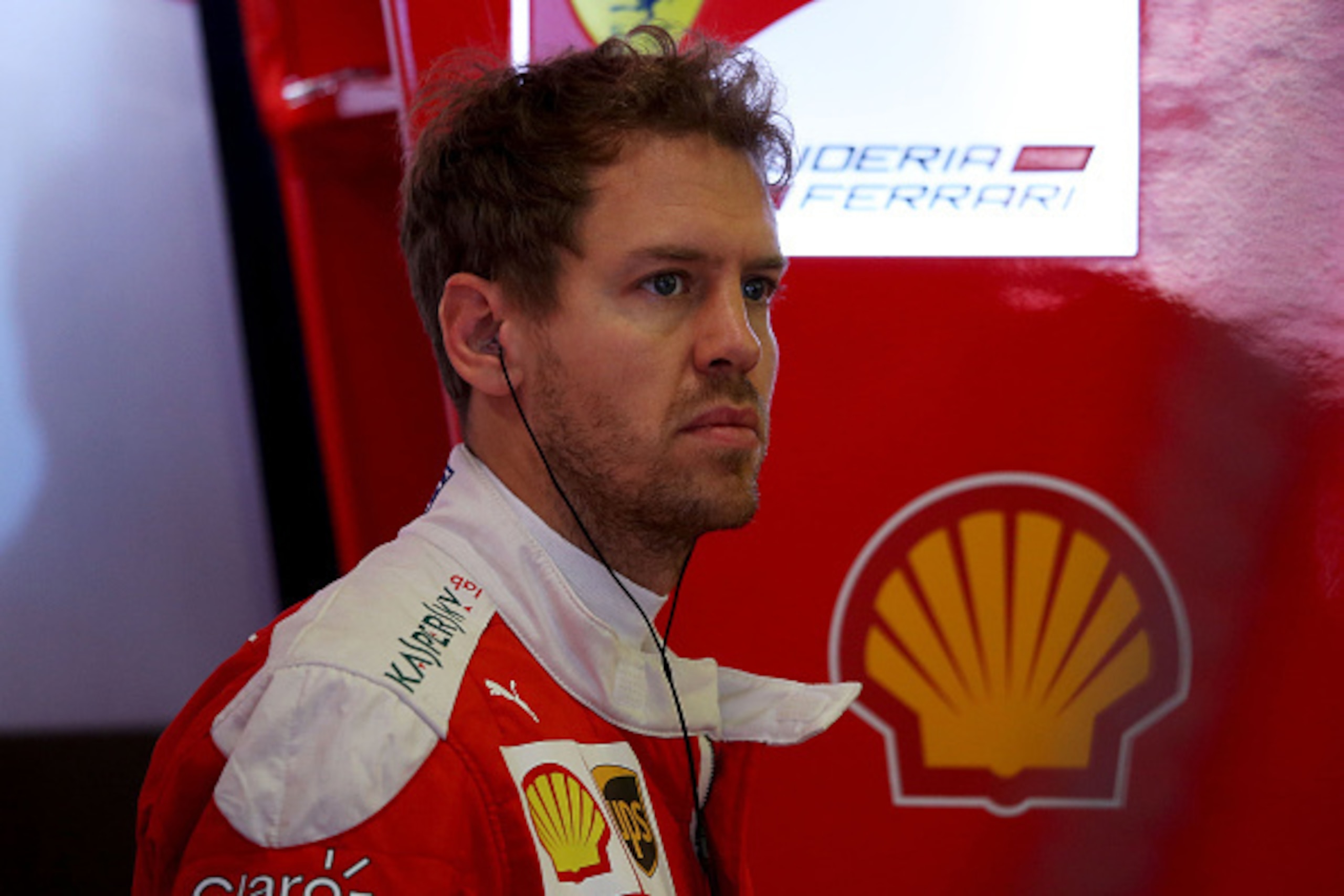 MELBOURNE, AUSTRALIA - MARCH 18: Sebastian Vettel of Germany and Ferrari in the garage during practice ahead of the Australian Formula One Grand Prix at Albert Park on March 18, 2016 in Melbourne, Australia.  (Photo by Lars Baron/Getty Images)