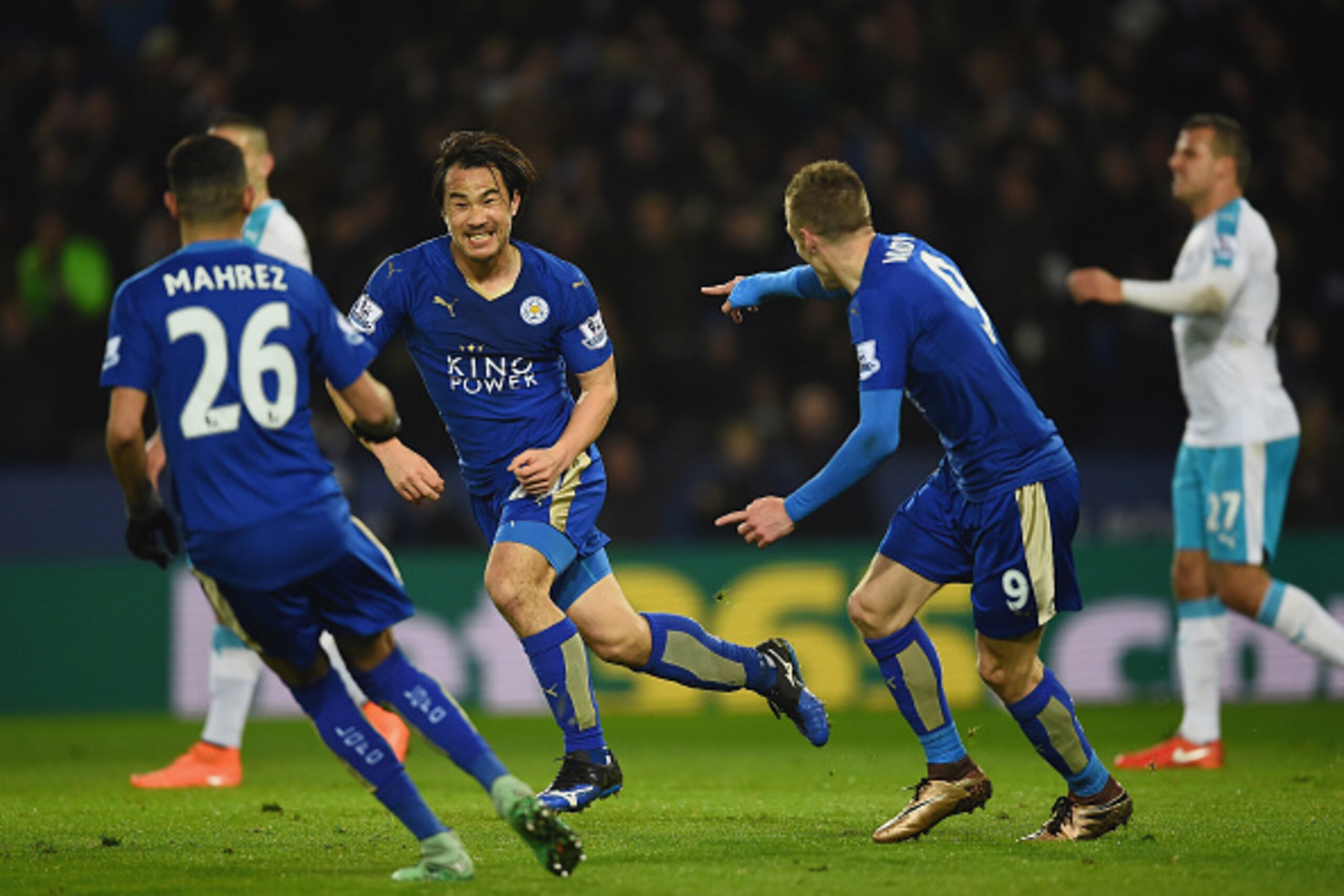 LEICESTER, ENGLAND - MARCH 14:  Shinji Okazaki of Leicester City (2L) celebrates with team mates as he scores their first goal with an overhead kick during the Barclays Premier League match between Leicester City and Newcastle United at The King Power Sta