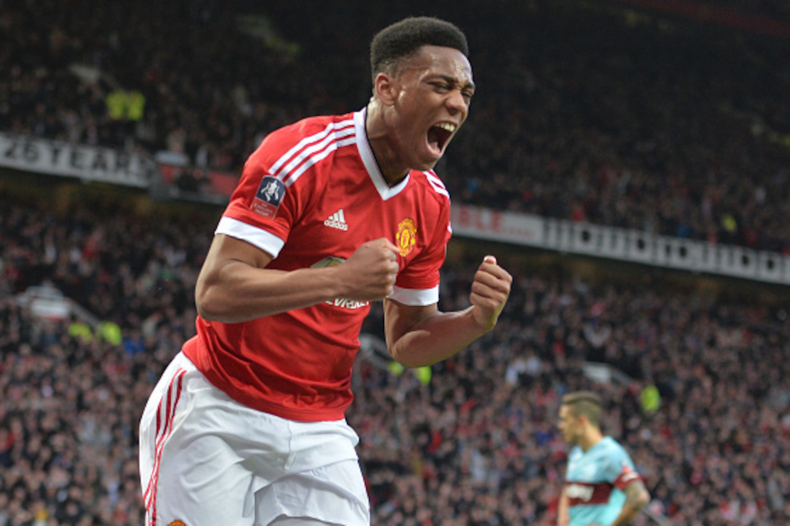 Manchester United's French striker Anthony Martial celebrates after scoring their first goal during the English FA Cup quarter final football match between Manchester United and West Ham United at Old Trafford in Manchester, north west England, on March 1