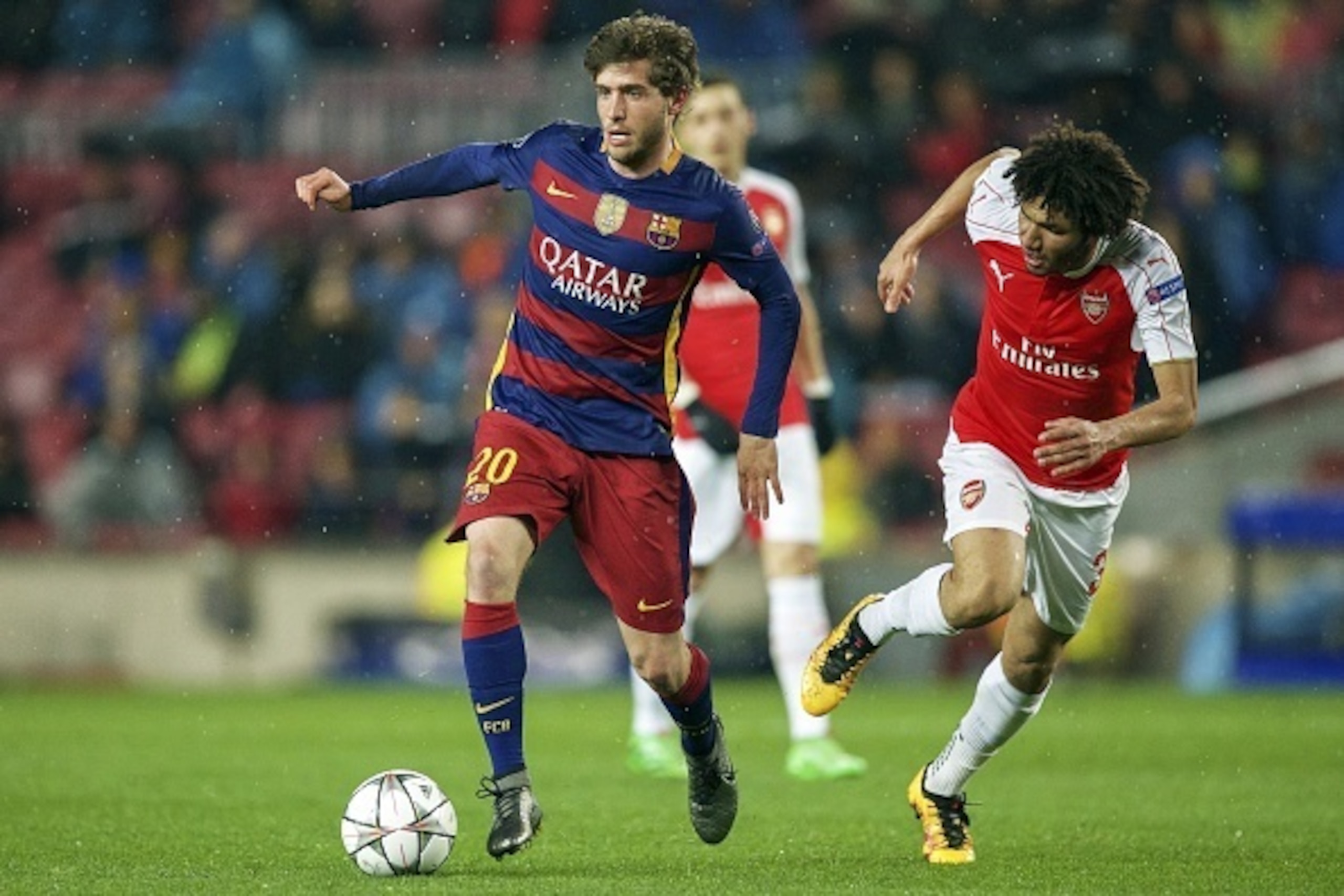 (L-R) Sergi Roberto of FC Barcelona, Mohamed Elneny of Arsenal FC during the UEFA Champions League round of 16 match between FC Barcelona and Arsenal on March 16, 2015 at the CampNou stadium in Barcelona, Spain.(Photo by VI Images via Getty Images)