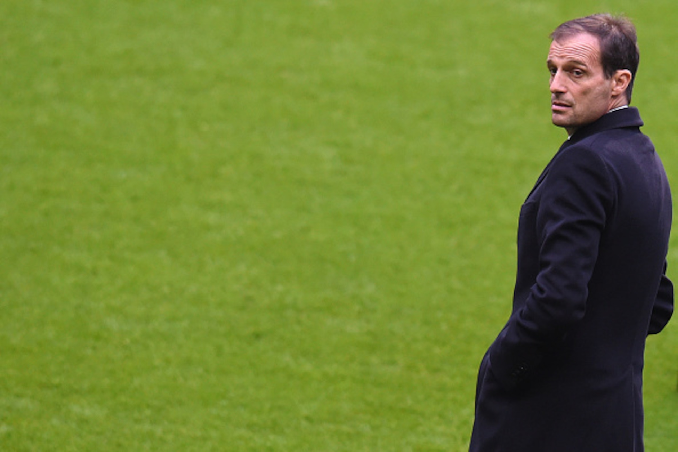 Juventus headcoach Massimiliano Allegri watches the stadium prior a press conference, one day before the Champions League last 16, second-leg match between Bayern Munich and Juventus Turin in the stadium in Munich, southern Germany, on March 15, 2016.  / 
