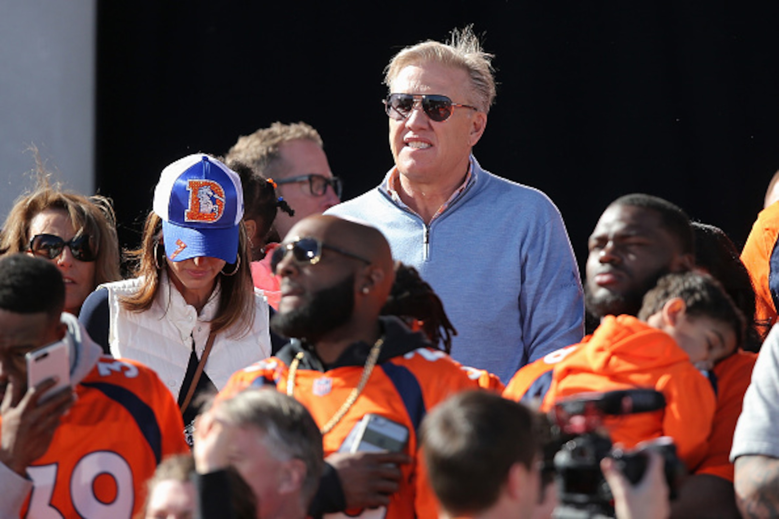 DENVER, CO - FEBRUARY 09:  John Elway, Executive Vice President of Football Operations and General Manager of the Denver Broncos looks on from the stage as the Super Bowl 50 Champion Denver Broncos are celebrated at a rally on the steps of the Denver City