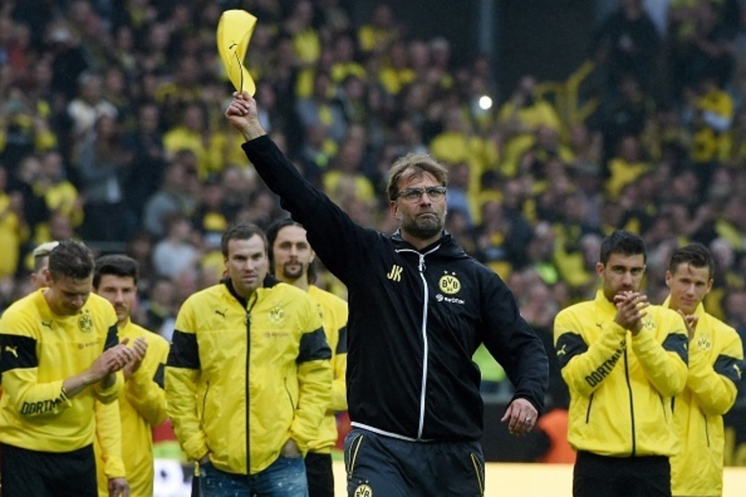 Dortmund's head coach Juergen Klopp and Dortmund's players celebrate after the German first division Bundesliga football match between Borussia Dortmund and SV Werder Bremen at the Signal Iduna Park in Dortmund, western Germany on May 23, 2015. Dortmund w Dortmund's head coach Juergen Klopp and Dortmund's players celebrate after the German first division Bundesliga football match between Borussia Dortmund and SV Werder Bremen at the Signal Iduna Park in Dortmund, western Germany on May 23, 2015. Dortmund w