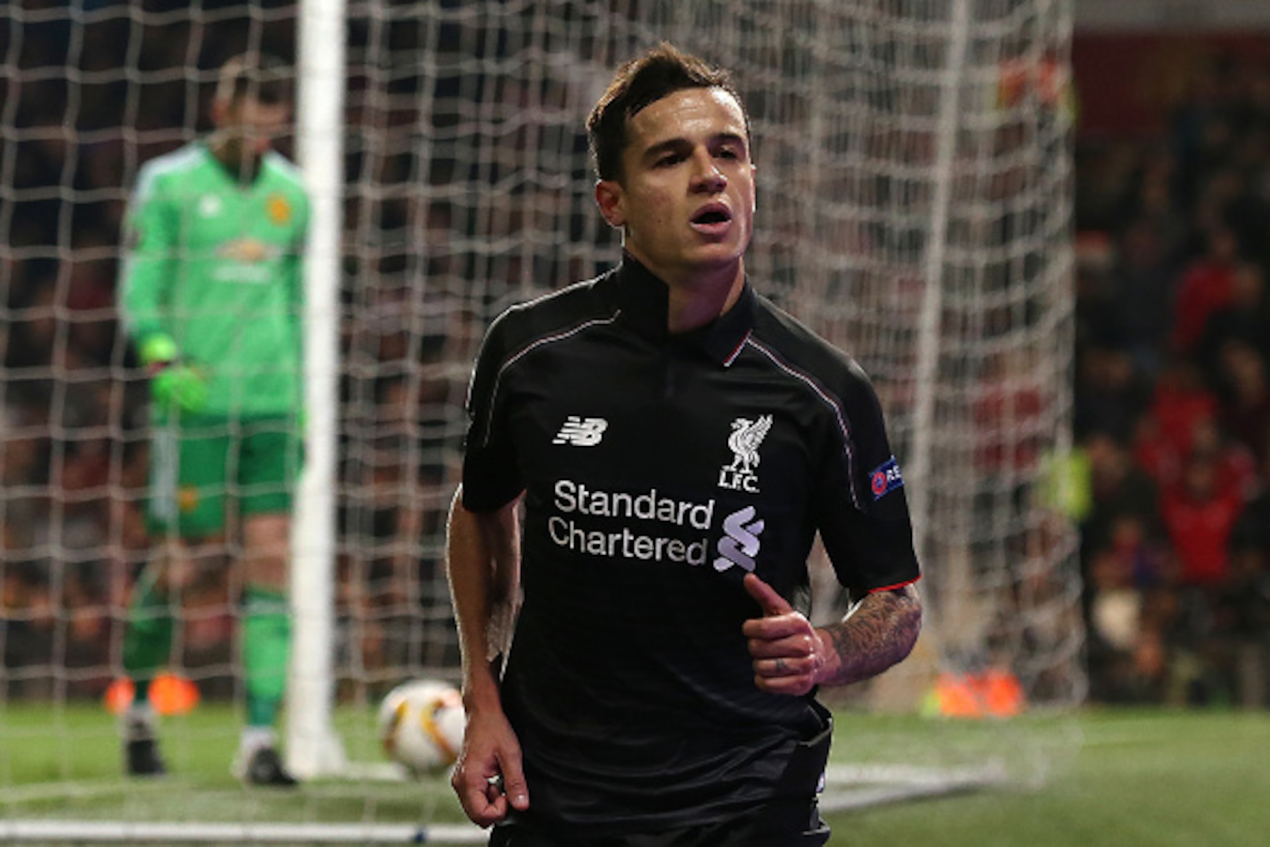 MANCHESTER, ENGLAND - MARCH 17: Philippe Coutinho of Liverpool celebrates scoring his team's first goal during the UEFA Europa League Round of 16 Second Leg match between Manchester United and Liverpool at Old Trafford on March 17, 2016 in Manchester, En MANCHESTER, ENGLAND - MARCH 17: Philippe Coutinho of Liverpool celebrates scoring his team's first goal during the UEFA Europa League Round of 16 Second Leg match between Manchester United and Liverpool at Old Trafford on March 17, 2016 in Manchester, En