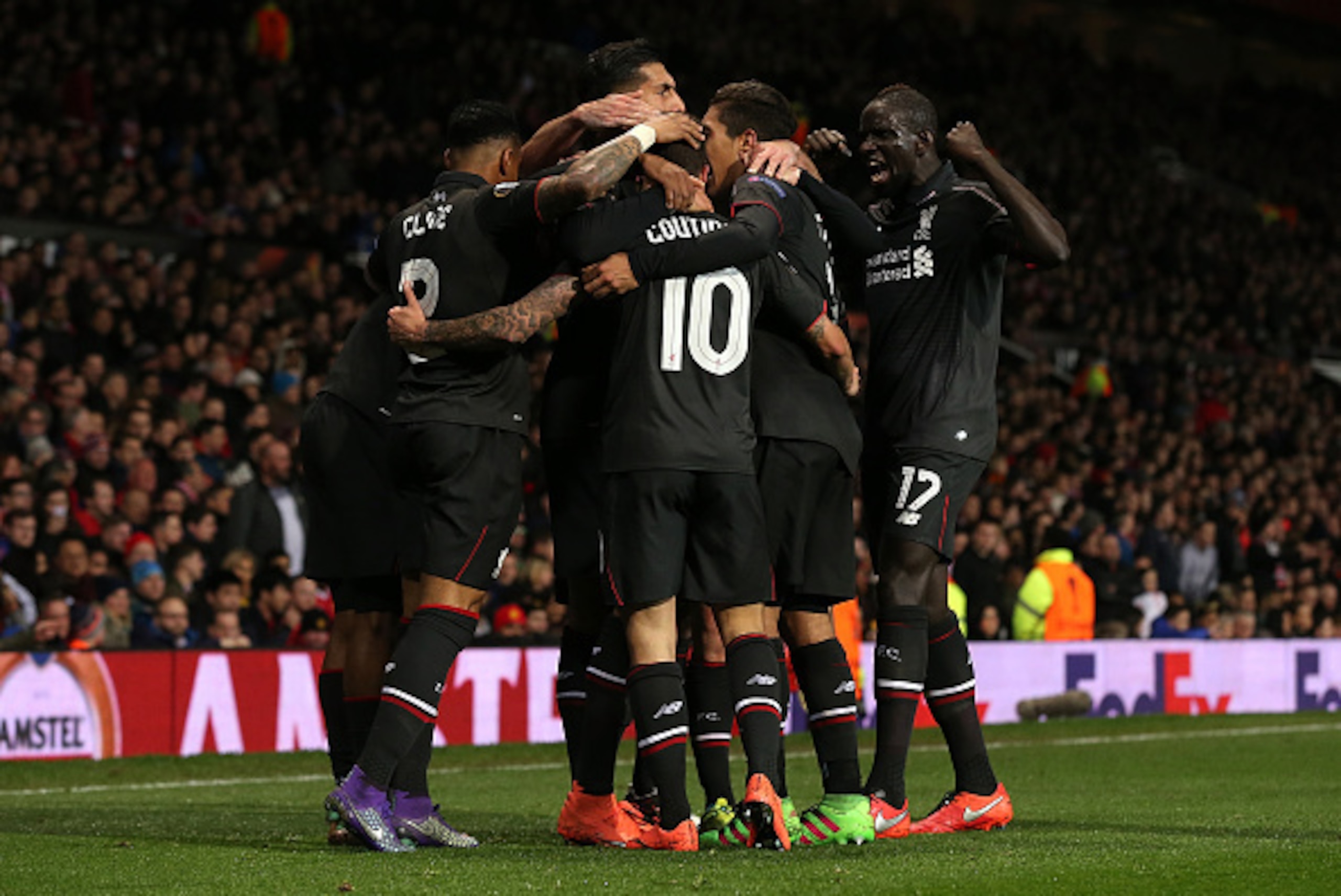 MANCHESTER, ENGLAND - MARCH 17: Philippe Coutinho of Liverpool celebrates scoring his team's first goal with his team-mates during the UEFA Europa League Round of 16 Second Leg match between Manchester United and Liverpool at Old Trafford on March 17, 20 MANCHESTER, ENGLAND - MARCH 17: Philippe Coutinho of Liverpool celebrates scoring his team's first goal with his team-mates during the UEFA Europa League Round of 16 Second Leg match between Manchester United and Liverpool at Old Trafford on March 17, 20
