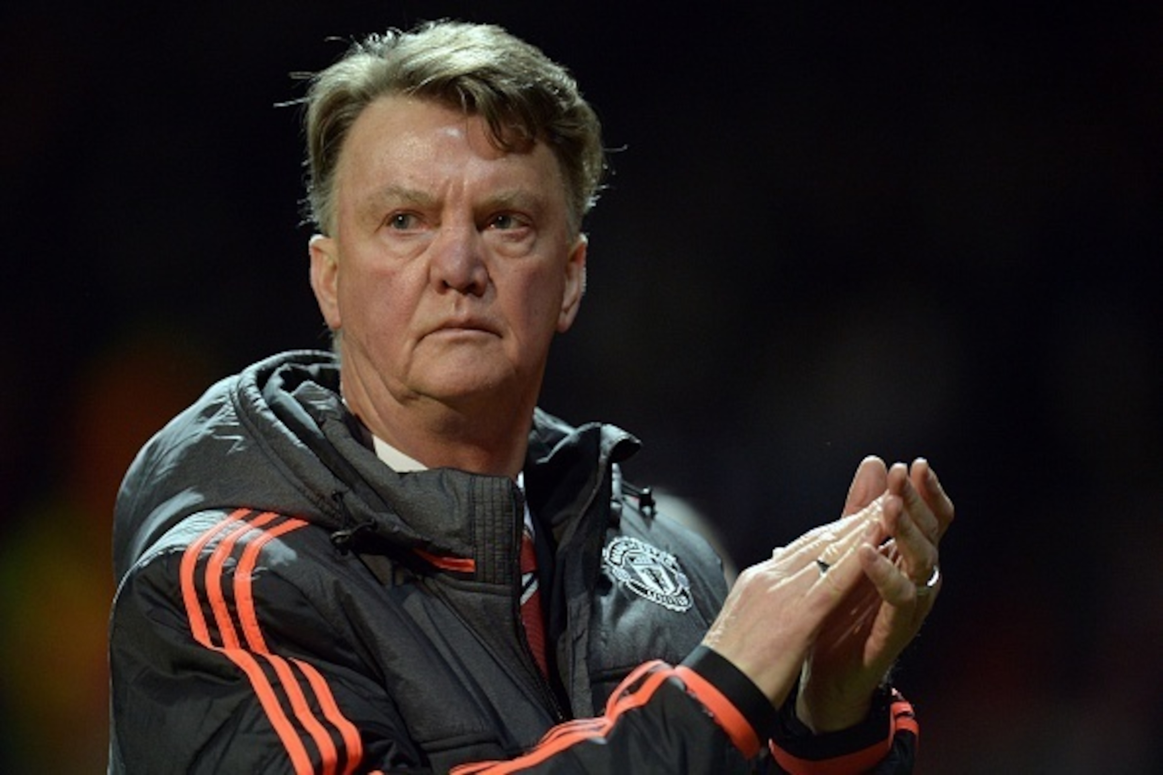 Manchester United's Dutch manager Louis van Gaal applauds supporters after the UEFA Europa League round of 16, second leg football match between Manchester United and Liverpool at Old Trafford in Manchester, north west England on March 17, 2016.
The game 