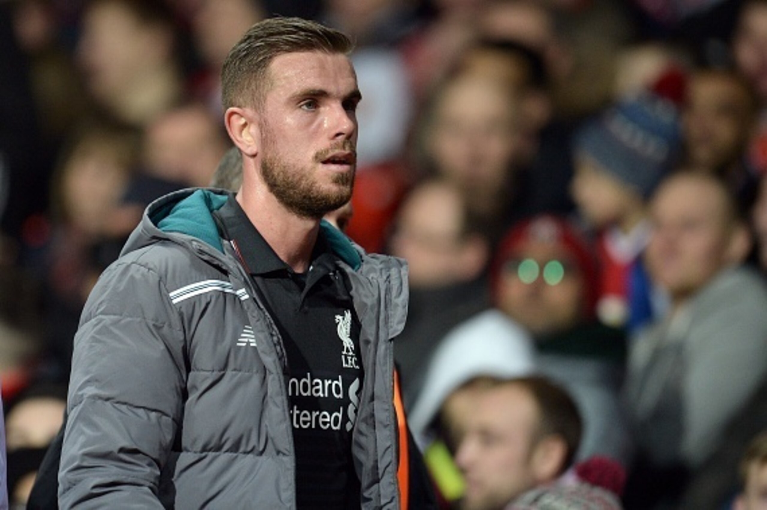 Liverpool's English midfielder Jordan Henderson reacts as he leaves after being substituted during the UEFA Europa League round of 16, second leg football match between Manchester United and Liverpool at Old Trafford in Manchester, north west England on M