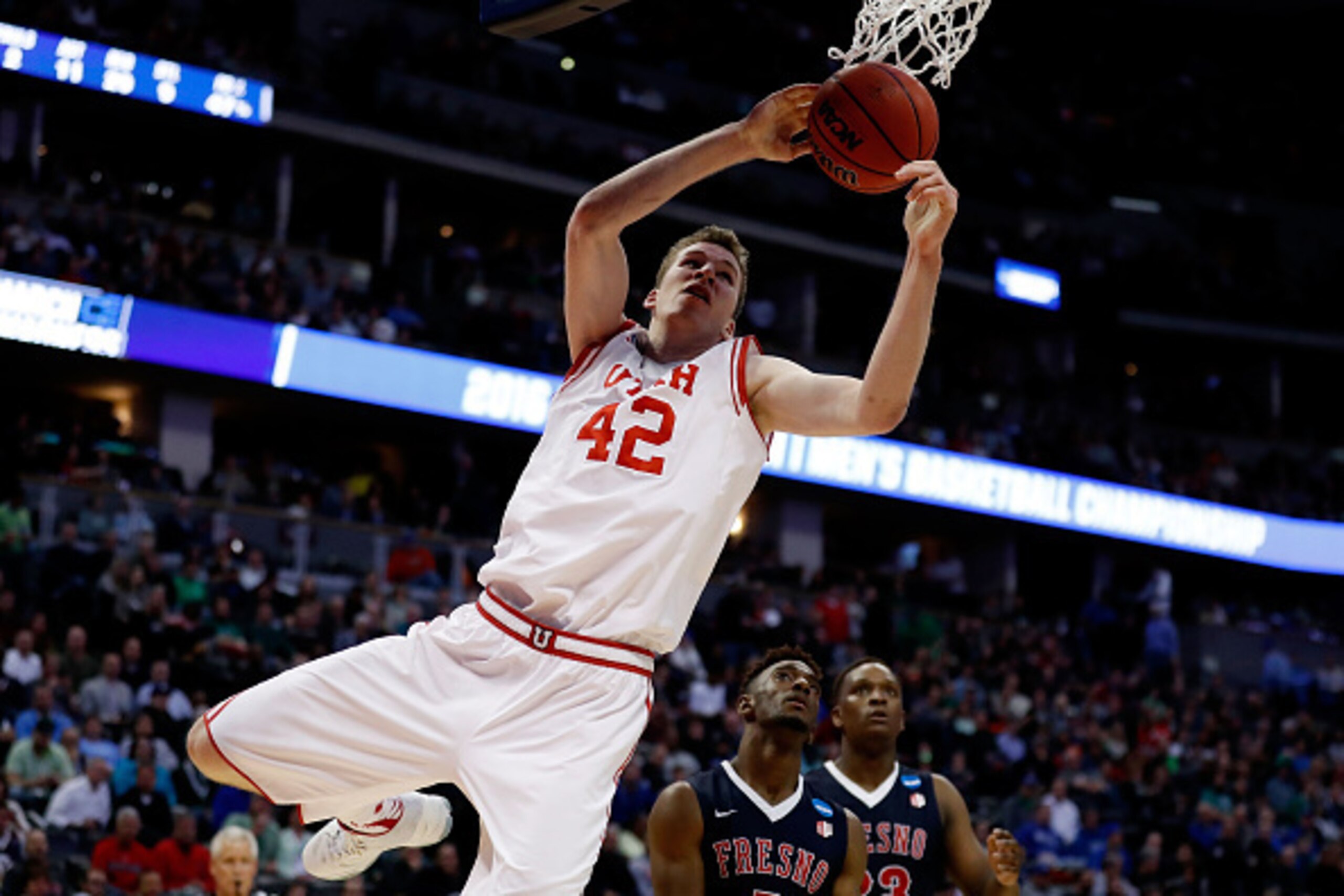 DENVER, CO - MARCH 17:  Jakob Poeltl #42 of the Utah Utes rebounds against the Fresno State Bulldogs in the second half during the first round of the 2016 NCAA Men's Basketball Tournament at Pepsi Center on March 17, 2016 in Denver, Colorado.  (Photo by J