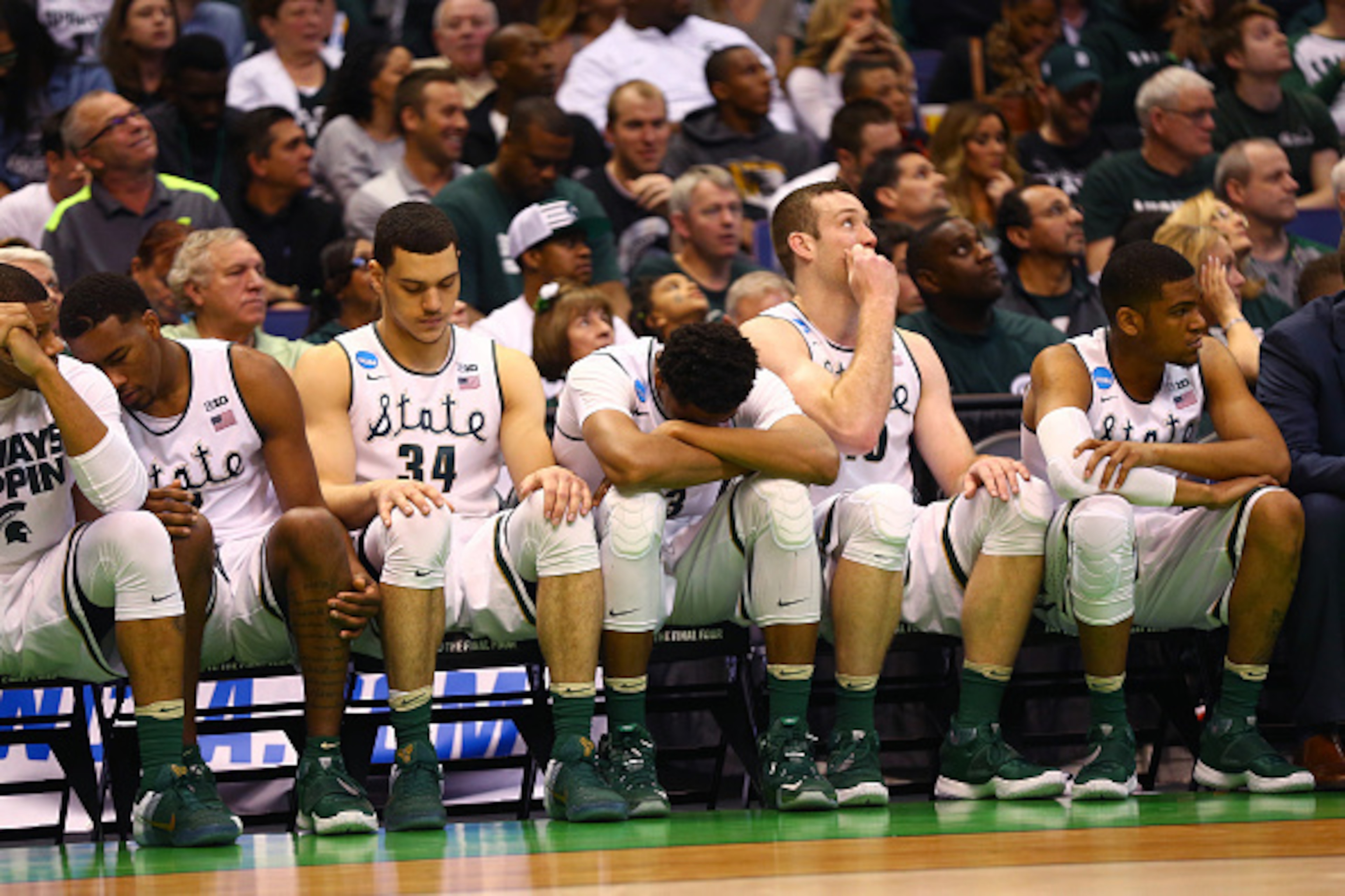 ST LOUIS, MO - MARCH 18: The Michigan State Spartans bench looks on late in the game against the Middle Tennessee Blue Raiders during the first round of the 2016 NCAA Men's Basketball Tournament at Scottrade Center on March 18, 2016 in St Louis, Missouri. ST LOUIS, MO - MARCH 18: The Michigan State Spartans bench looks on late in the game against the Middle Tennessee Blue Raiders during the first round of the 2016 NCAA Men's Basketball Tournament at Scottrade Center on March 18, 2016 in St Louis, Missouri.
