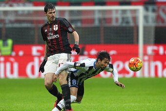MILAN, ITALY - FEBRUARY 07:  Ryder Matos Santos (R) of Udinese Calcio competes for the ball with Alessio Romagnoli (L) of AC Milan during the Serie A match between AC Milan and Udinese Calcio at Stadio Giuseppe Meazza on February 7, 2016 in Milan, Italy. 