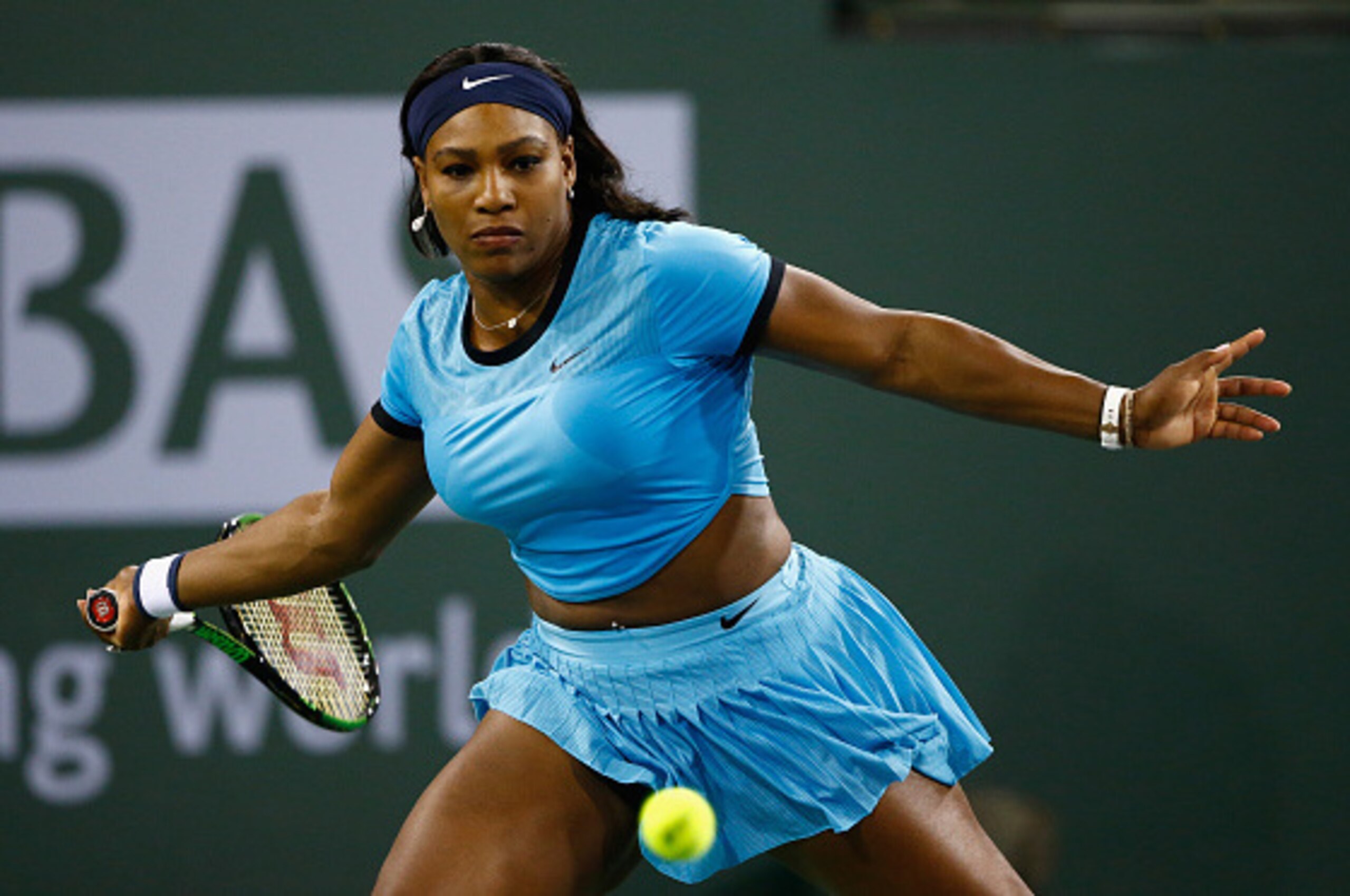 INDIAN WELLS, CA - MARCH 18:  Serena Williams of USA in action against Agnieszka Radwanska of Poland during day twelve of the BNP Paribas Open at Indian Wells Tennis Garden on March 18, 2016 in Indian Wells, California.  (Photo by Julian Finney/Getty Imag