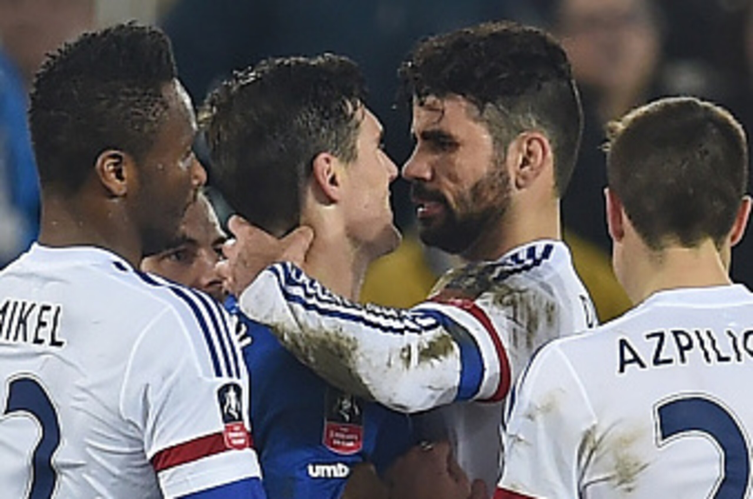 Chelsea's Brazilian-born Spanish striker Diego Costa (2nd R) and Everton's English midfielder Gareth Barry clash in the incident leading to Costa's second yellow card during the English FA cup quarter-final football match between Everton and Chelsea at Go