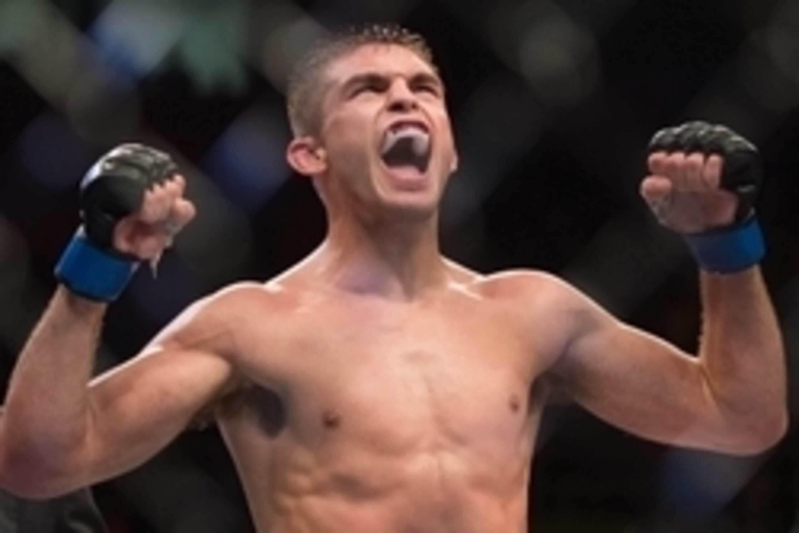 Nov 7, 2015; Sao Paulo, Brazil; Johnny Case (blue gloves) reacts after defeating Yan Cabral during UFC Fight Night at Ibirapuera Gymnasium. Mandatory Credit: Jason Silva-USA TODAY Sports