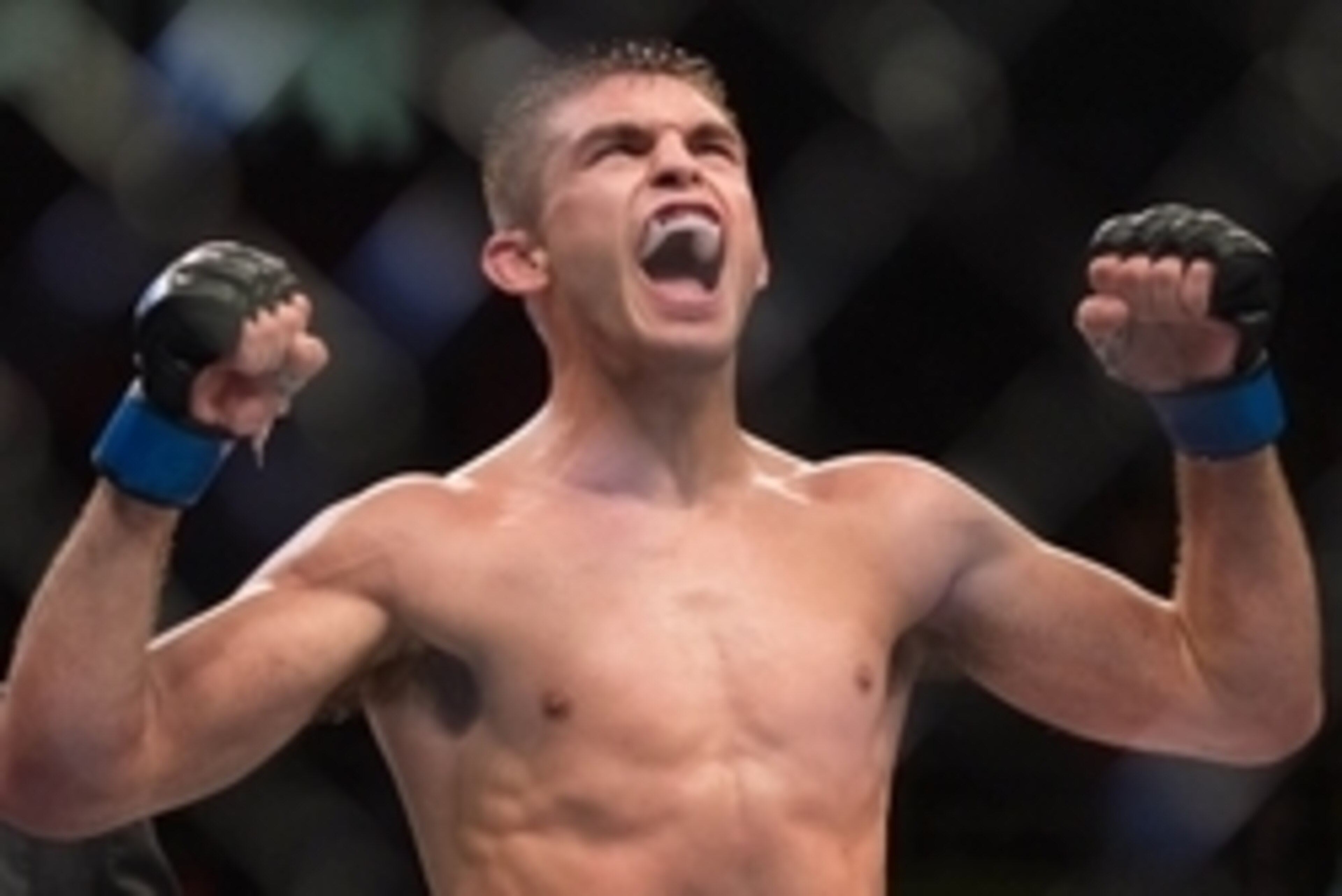 Nov 7, 2015; Sao Paulo, Brazil; Johnny Case (blue gloves) reacts after defeating Yan Cabral during UFC Fight Night at Ibirapuera Gymnasium. Mandatory Credit: Jason Silva-USA TODAY Sports