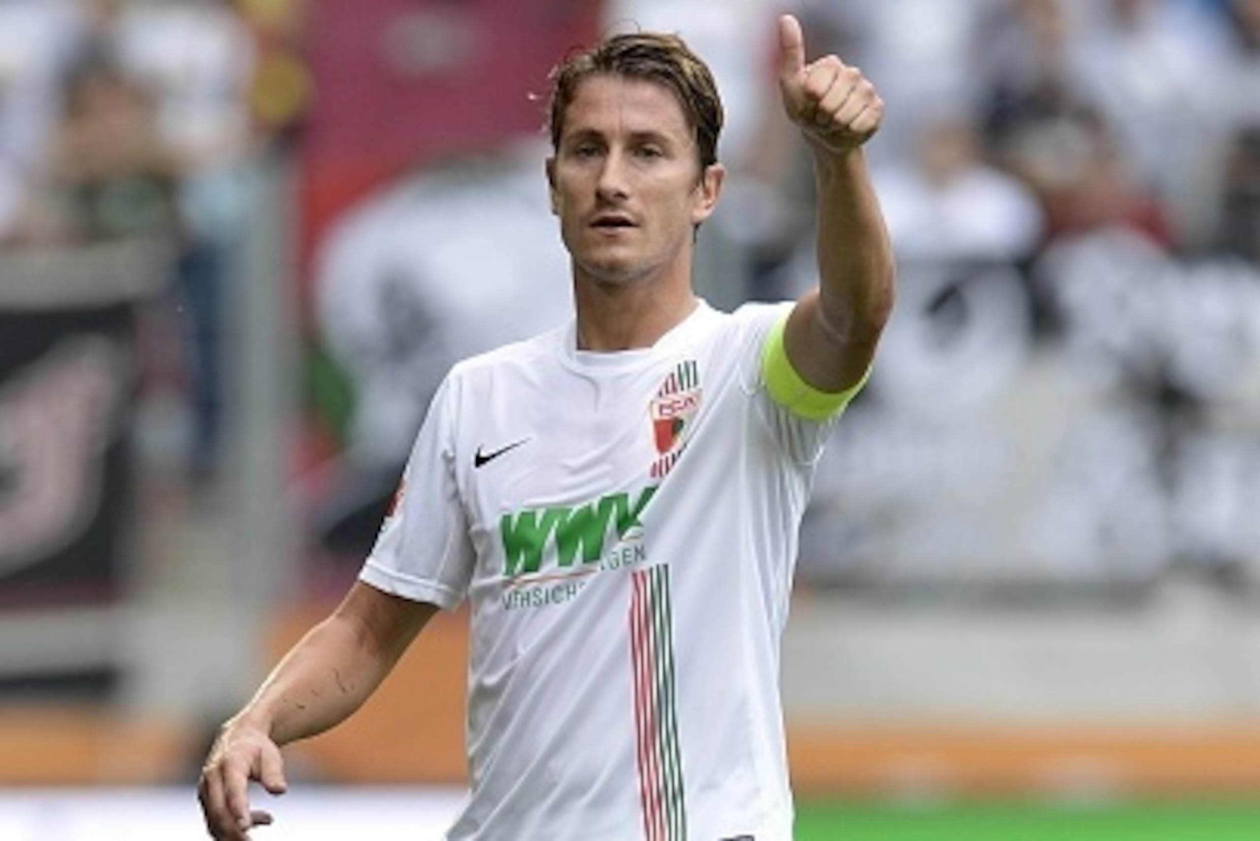 Augsburg's Dutch defender Paul Verhaegh gestures during the German first division Bundesliga football match FC Augsburg vs Hertha Berlin in Augsburg southern Germany, on August 15, 2015.  AFP PHOTO / CHRISTOF STACHE  RESTRICTIONS: DURING MATCH TIME: DFL R