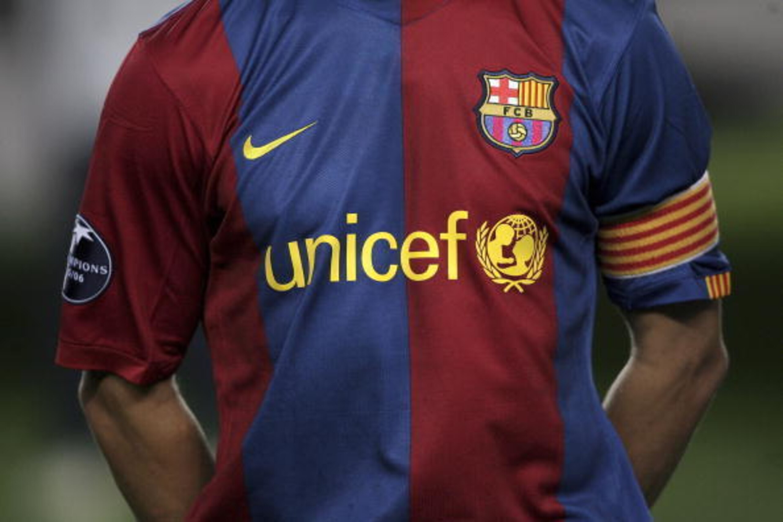 BARCELONA, SPAIN - SEPTEMBER 12:  The Barcelona captain Carles Puyol in the team line up before the game with their new 'UNICEF' shirt during the UEFA Champions League Group A match between Barcelona and Levski Sofia at The Nou Camp Stadium on September 1
