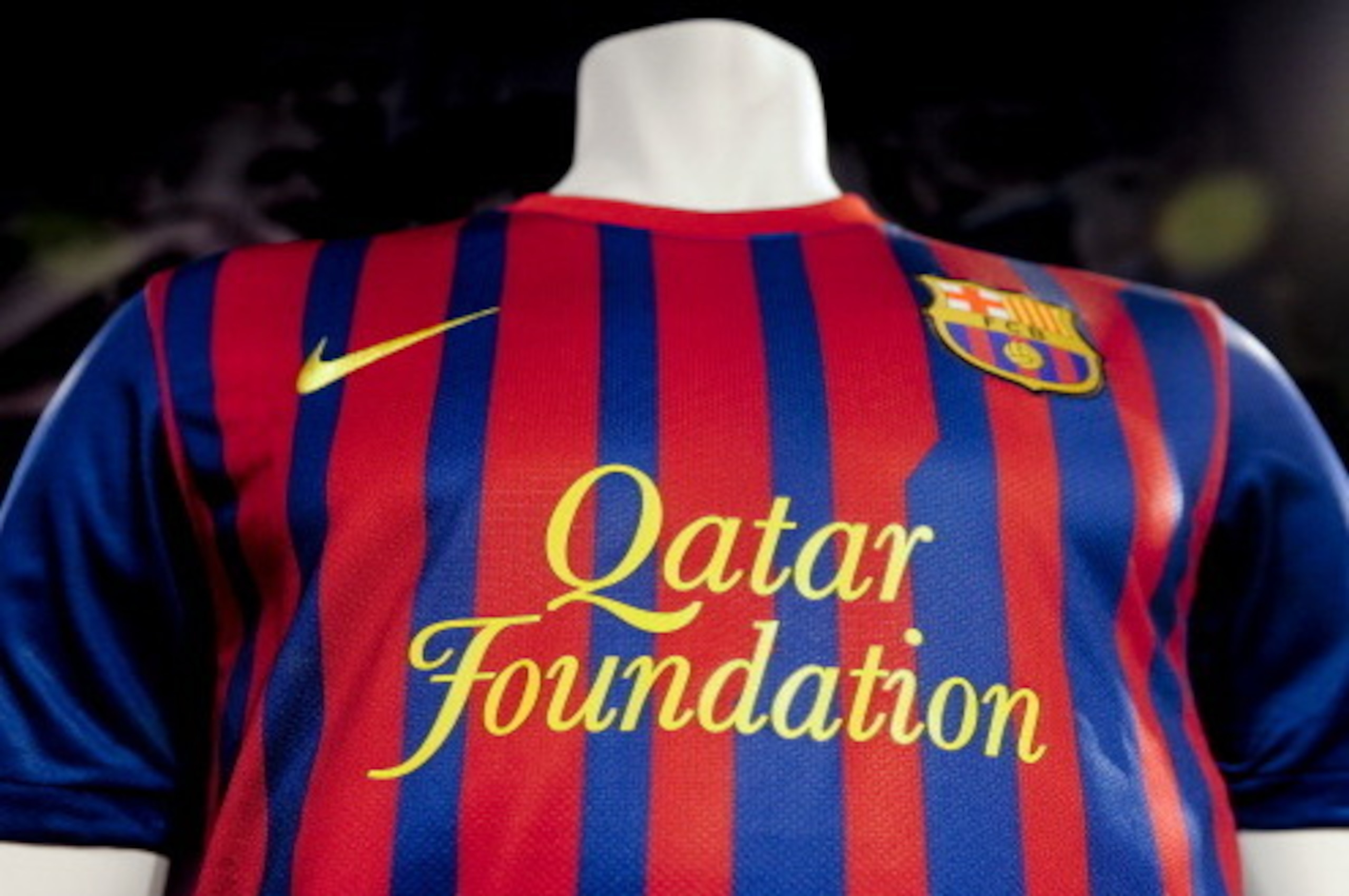 A mannequin displays Barcelona's new football team jersey featuring the name of the club's new sponsor the Qatar Foundation in Barcelona on May 17, 2011. The Qatar Foundation signed a record shirt sponsorship deal with Barcelona last December for 30 milli
