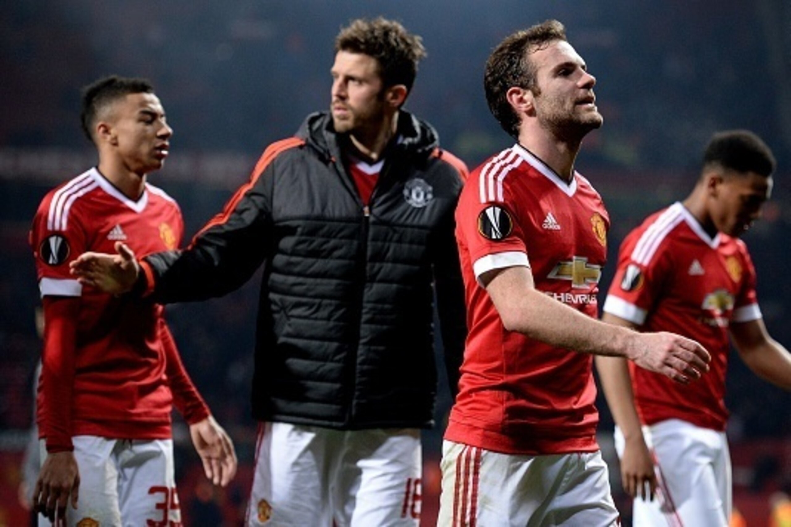 Manchester United's Spanish midfielder Juan Mata (2nd R) reacts as he leaves the pitch after the UEFA Europa League round of 16, second leg football match between Manchester United and Liverpool at Old Trafford in Manchester, north west England on March 1