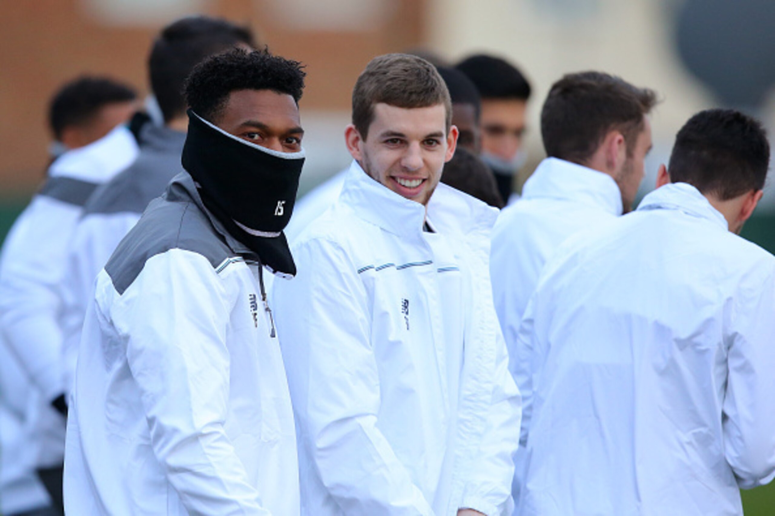 LIVERPOOL, ENGLAND - MARCH 09:  Daniel Sturridge of Liverpool speaks with Jon Flanagan of Liverpool during a training session ahead of the UEFA Europa League round of 16 first leg match between Liverpool and Manchester United at Melwood Training Ground on