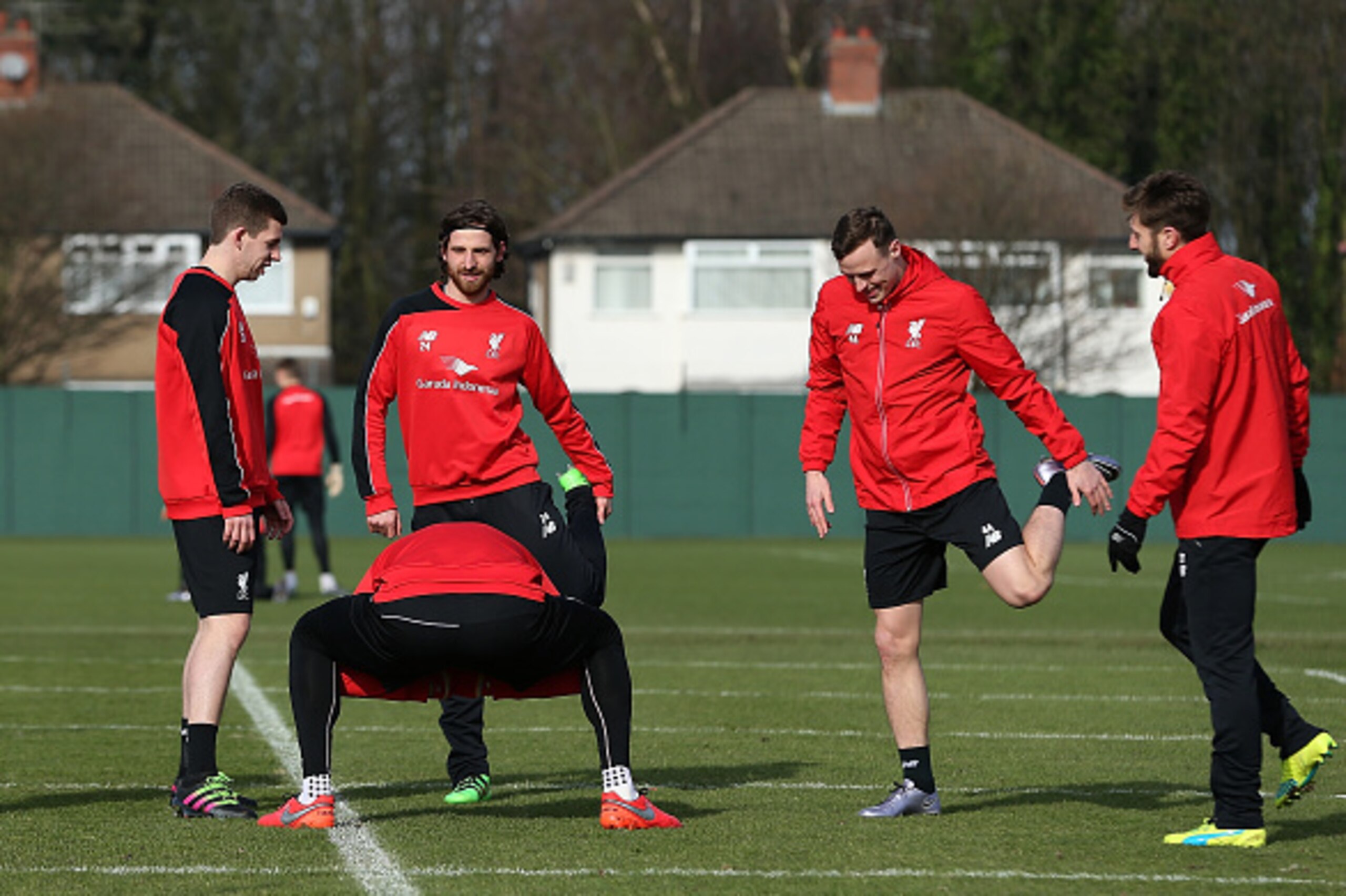 LIVERPOOL, ENGLAND - FEBRUARY 26:  Joe Allen(2ndL) looks on during a training session ahead of their Capital One Cup final match against Manchester City at Melwood Training Ground on February 26, 2016 in Liverpool, United Kingdom.  (Photo by Jan Kruger/Ge