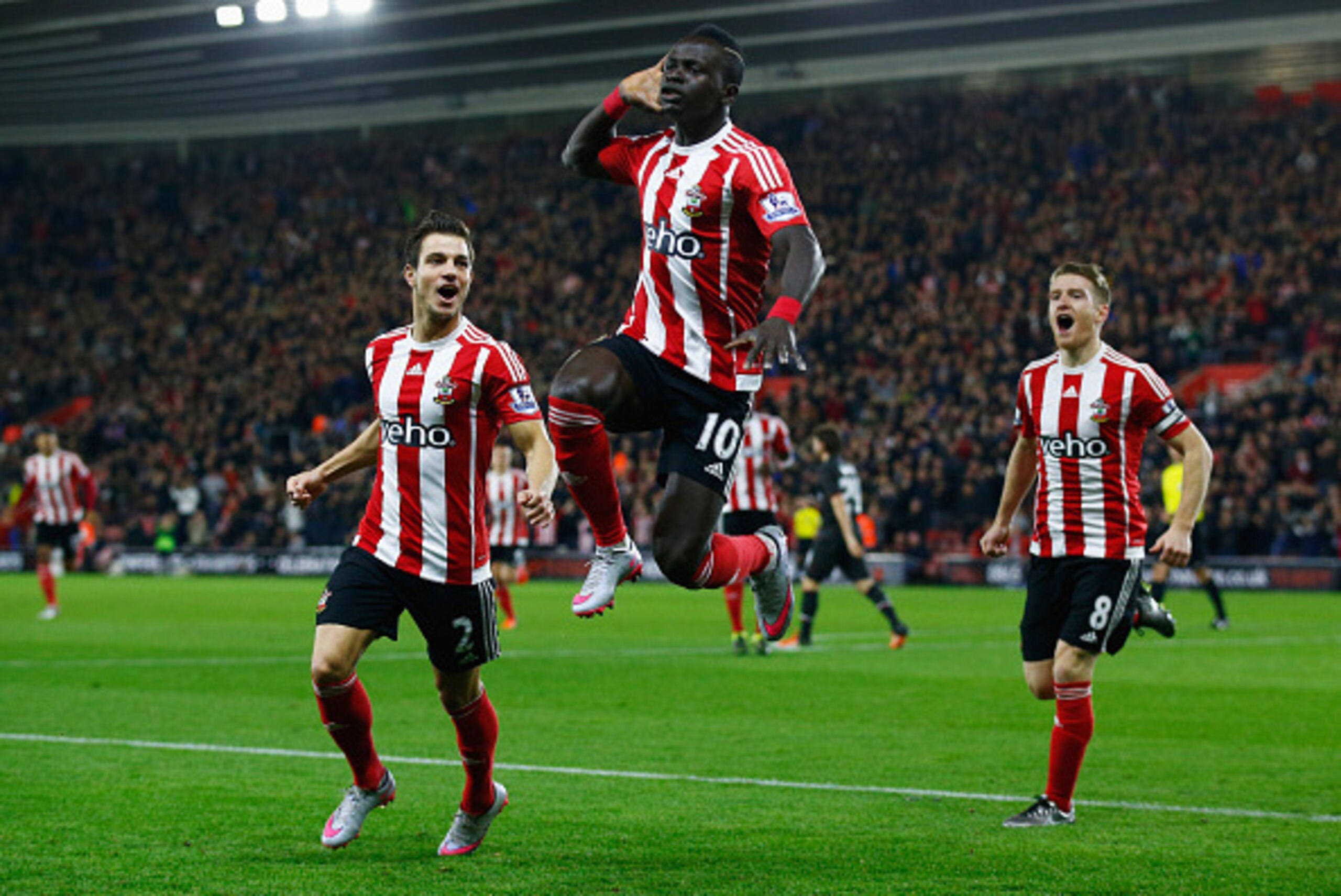 SOUTHAMPTON, ENGLAND - DECEMBER 02:  Sadio Mane of Southampton (10) celebrates with team mates as he scores their first goal with a header during the Capital One Cup quarter final match between Southampton and Liverpool at St Mary's Stadium on December 2,
