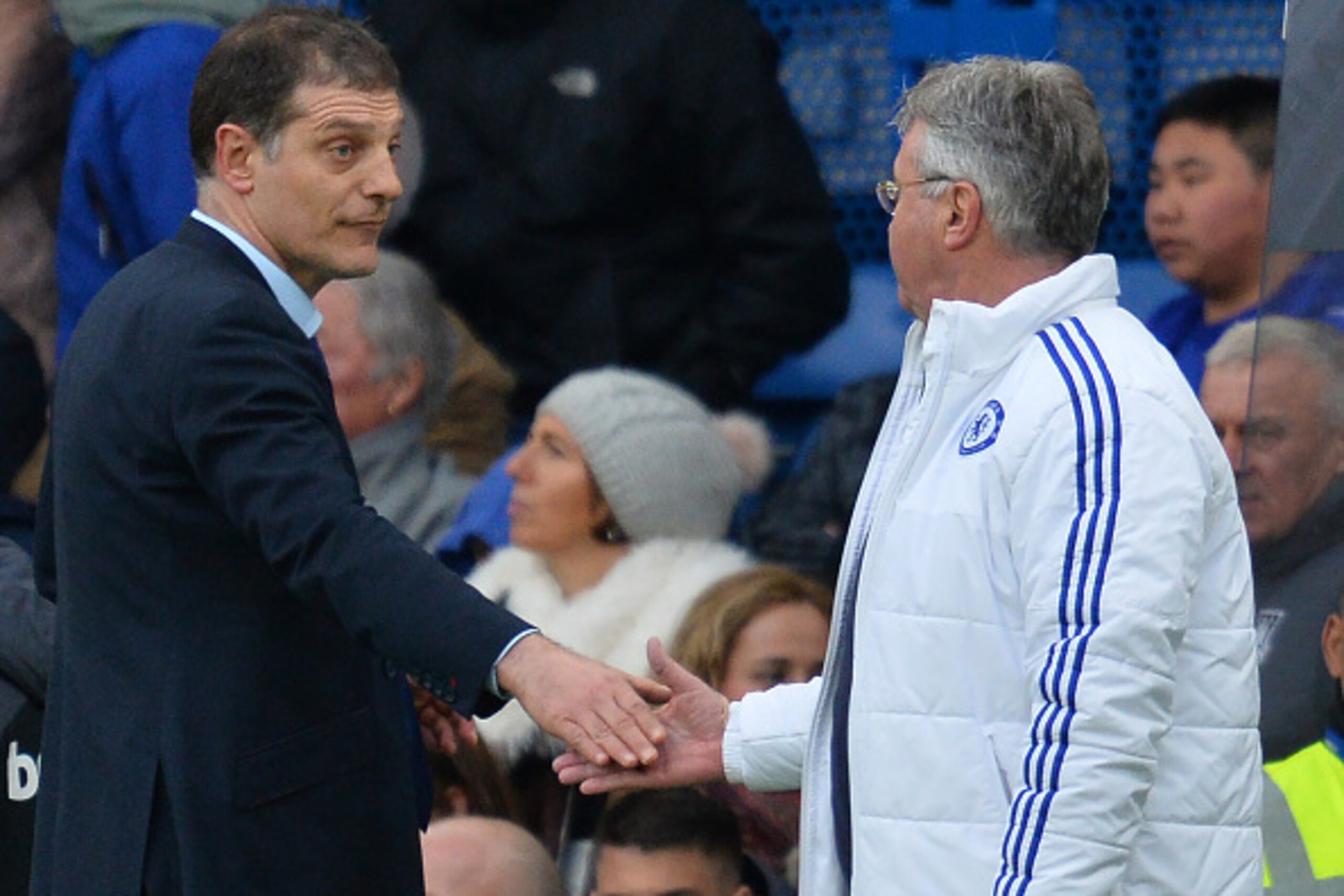 West Ham United's Croatian manager Slaven Bilic (L) shakes hands with Chelsea's Dutch interim manager Guus Hiddink after the English Premier League football match between Chelsea and West Ham United at Stamford Bridge in London on March 19, 2016.
The game