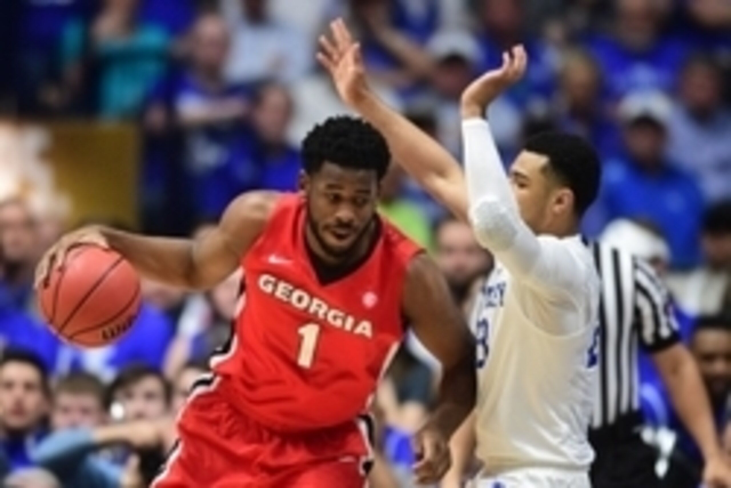 Mar 12, 2016; Nashville, TN, USA; Georgia Bulldogs forward Yante Maten (1) dribbles the ball as Kentucky Wildcats guard Jamal Murray (23) defends in the first half during the SEC conference tournament at Bridgestone Arena. Mandatory Credit: Christopher Ha