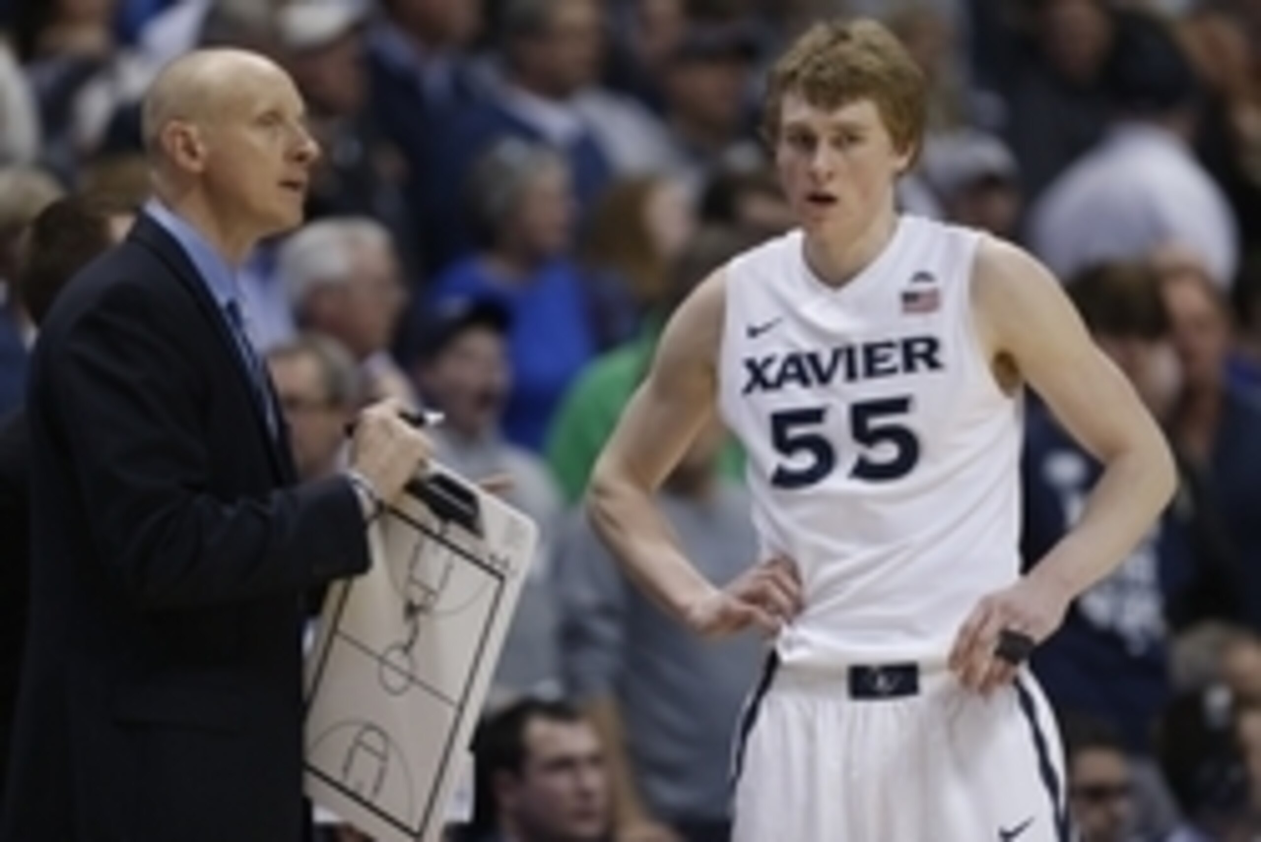 Mar 5, 2016; Cincinnati, OH, USA; Xavier Musketeers head coach Chris Mack talks to guard J.P. Macura (55) during the second half against the Creighton Bluejays at the Cintas Center. Xavier won 98-93. Mandatory Credit: Frank Victores-USA TODAY Sports