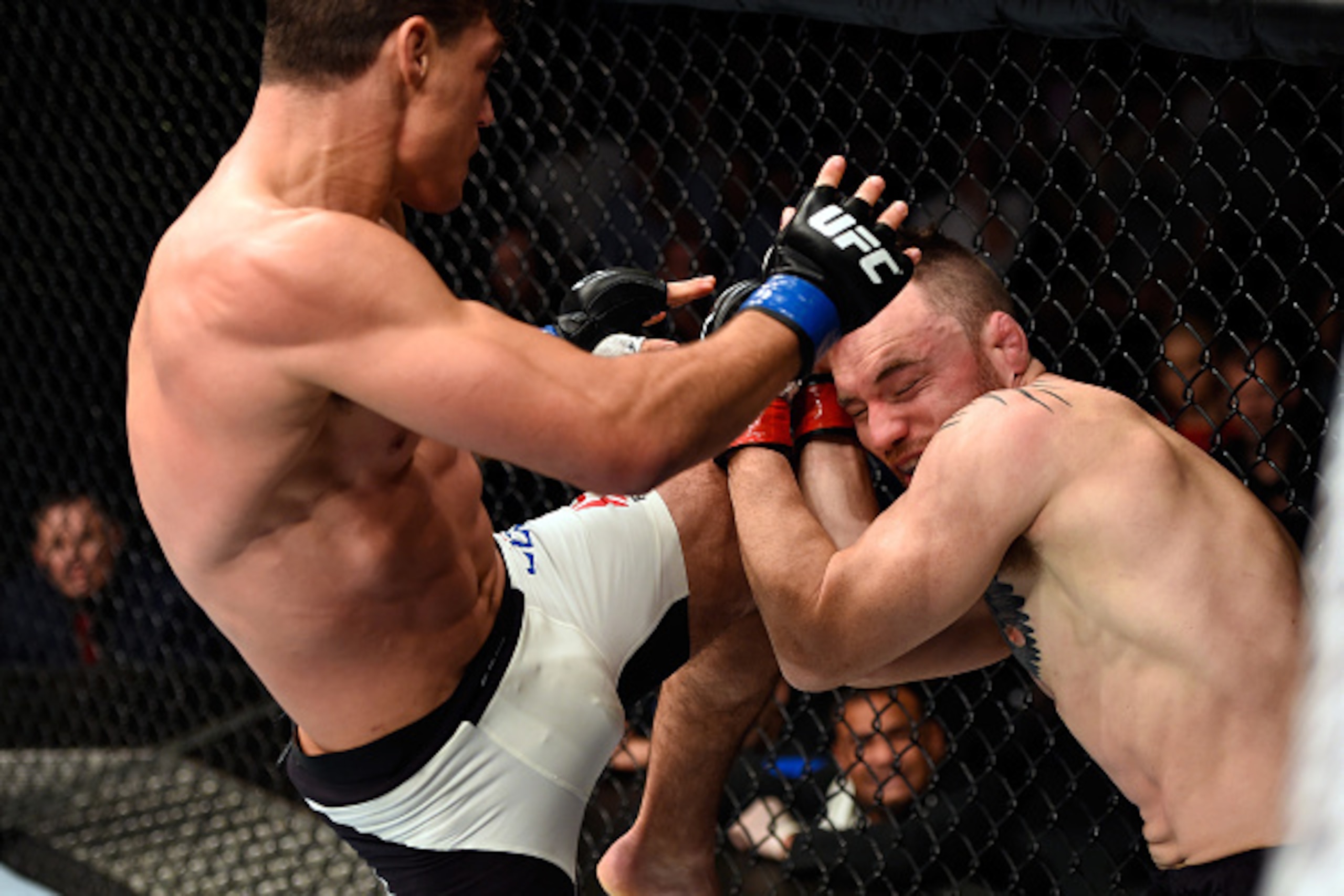 BRISBANE, AUSTRALIA - MARCH 20:  (L-R) Alan Jouban of the United States lands a knee to the head of Brendan O'Reilly of Australia in their welterweight bout during the UFC Fight Night event at the Brisbane Entertainment Centre on March 20, 2016 in Brisban