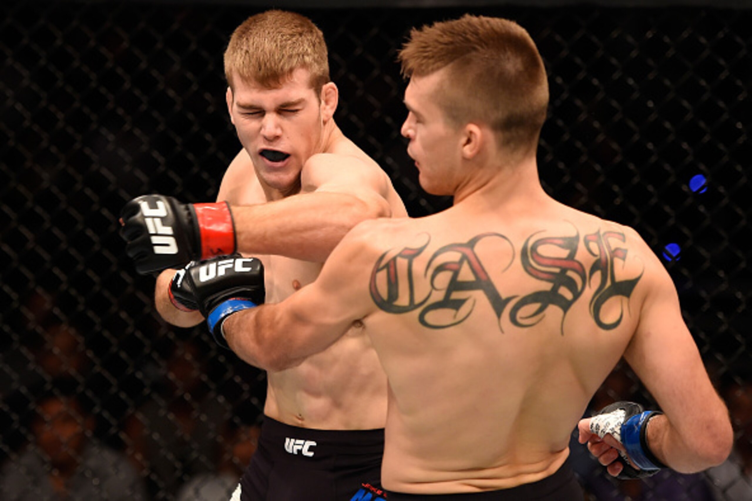 BRISBANE, AUSTRALIA - MARCH 20:  (L-R) Jake Matthews of Australia punches Johnny Case in their lightweight bout during the UFC Fight Night event at the Brisbane Entertainment Centre on March 20, 2016 in Brisbane, Australia. (Photo by Josh Hedges/Zuffa LLC