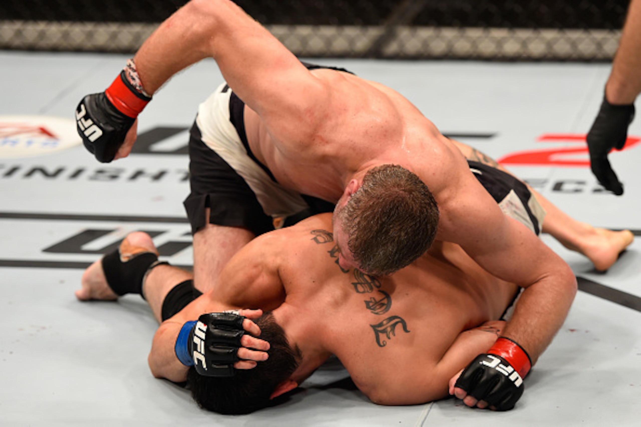 BRISBANE, AUSTRALIA - MARCH 20:  (L-R) Daniel Kelly of Australia punches Antonio Carlos Junior of Brazil in their middleweight bout during the UFC Fight Night event at the Brisbane Entertainment Centre on March 20, 2016 in Brisbane, Australia. (Photo by J