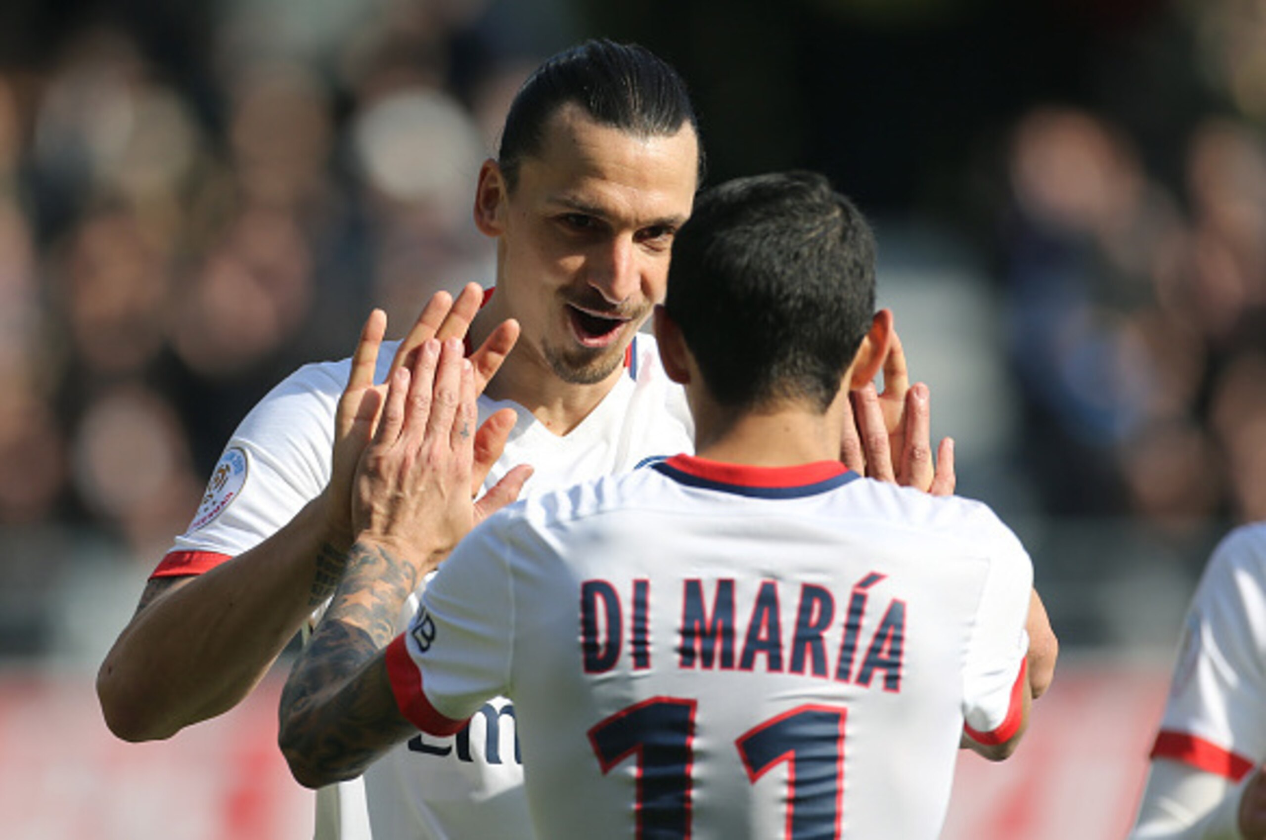 TROYES, FRANCE - MARCH 13: Zlatan Ibrahimovic of PSG celebrates his second goal with Angel Di Maria of PSG during the French Ligue 1 match between ESTAC Troyes and Paris Saint-Germain (PSG) at Stade de l'Aube on March 13, 2016 in Troyes, France. (Photo by