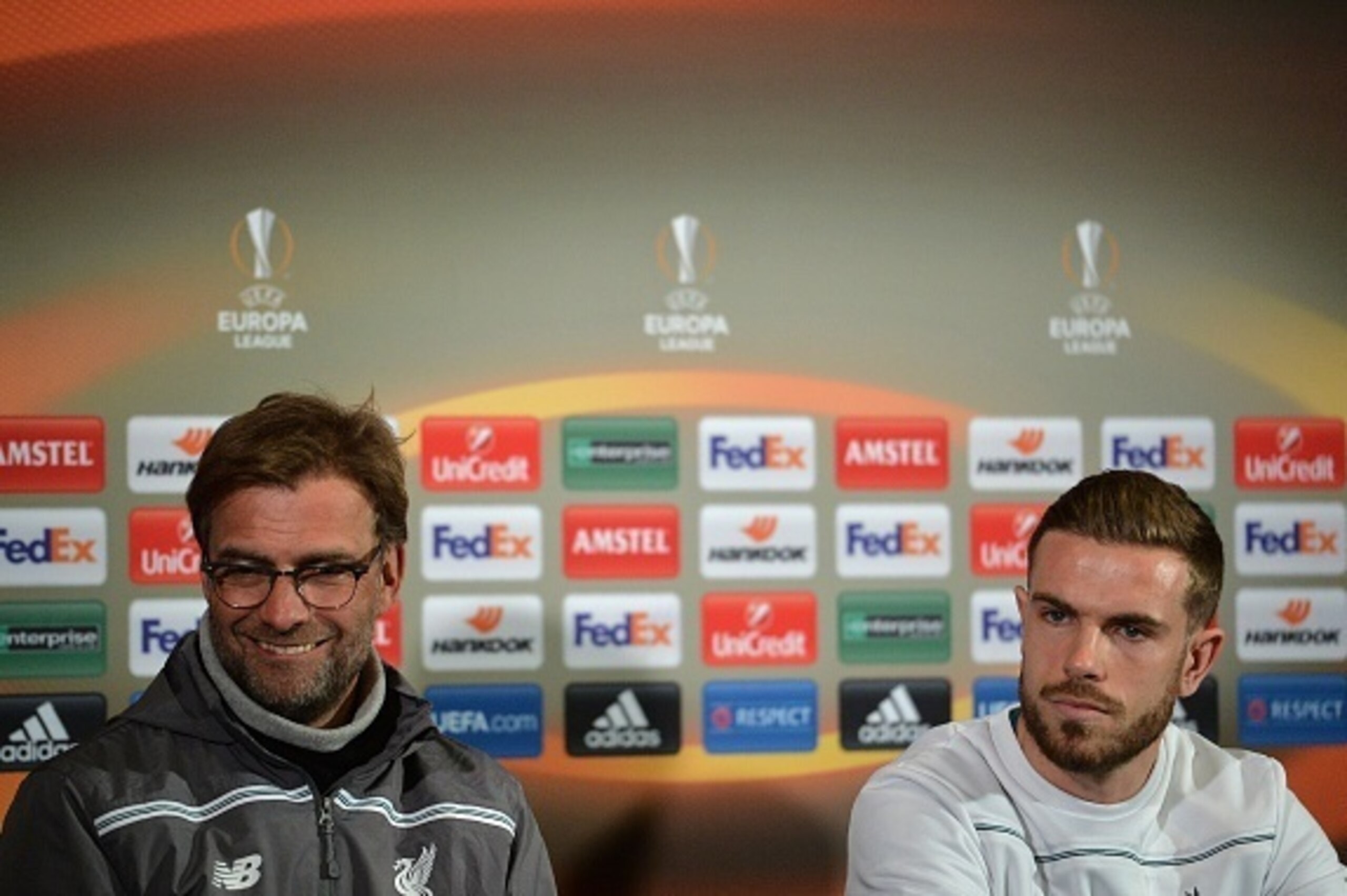 Liverpool's German manager Jurgen Klopp (L) and Liverpool's English midfielder Jordan Henderson attend a press conference at Old Trafford in Manchester, north west England, on March 16, 2016.
Manchester United will play Liverpool in a UEFA Europa League s