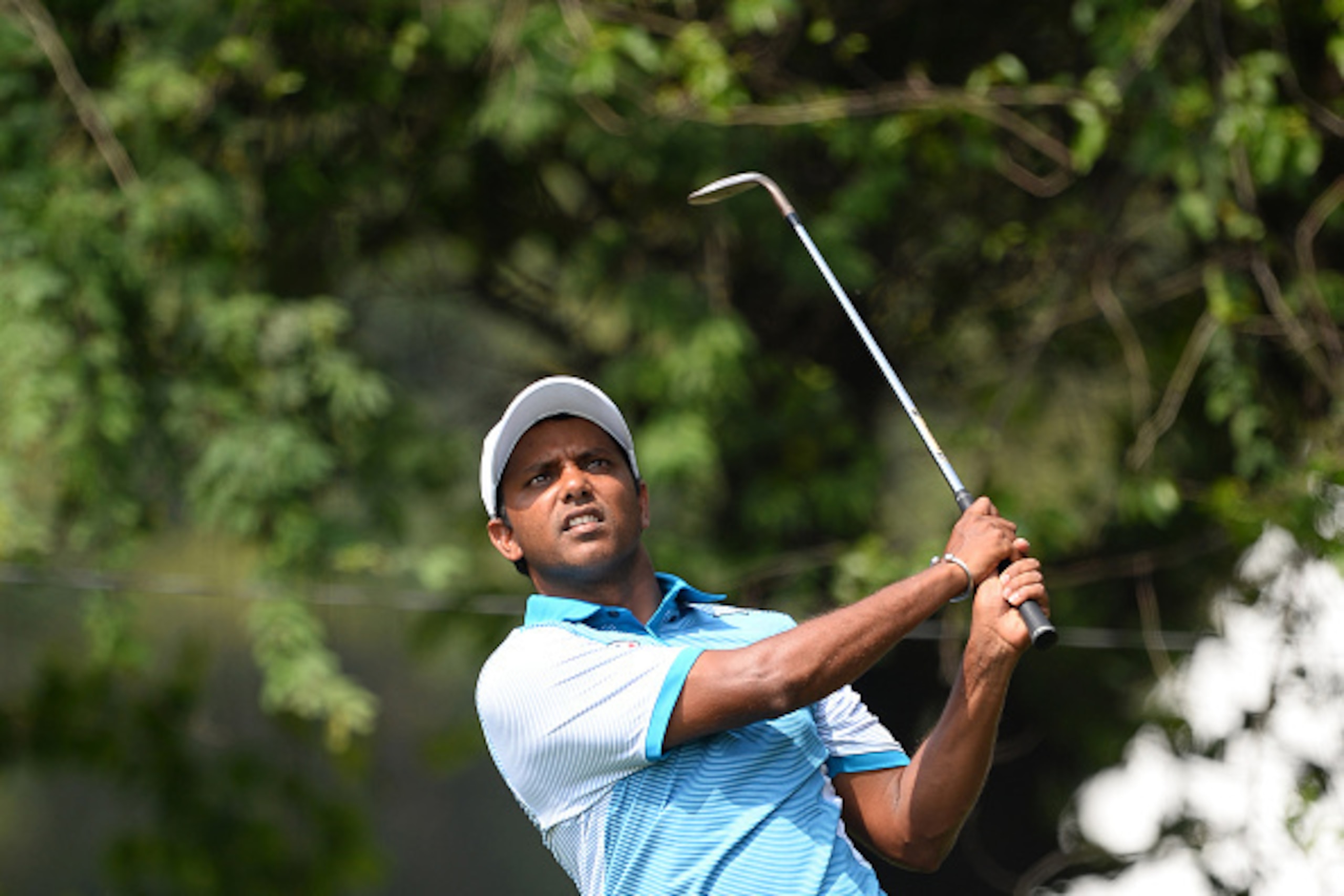 India's S.S.P Chawrasia plays a shot on the final day of the European Tour Indian Open golf tournament at the Delhi Golf Club in New Delhi on March 20, 2016. / AFP / SAJJAD HUSSAIN        (Photo credit should read SAJJAD HUSSAIN/AFP/Getty Images)