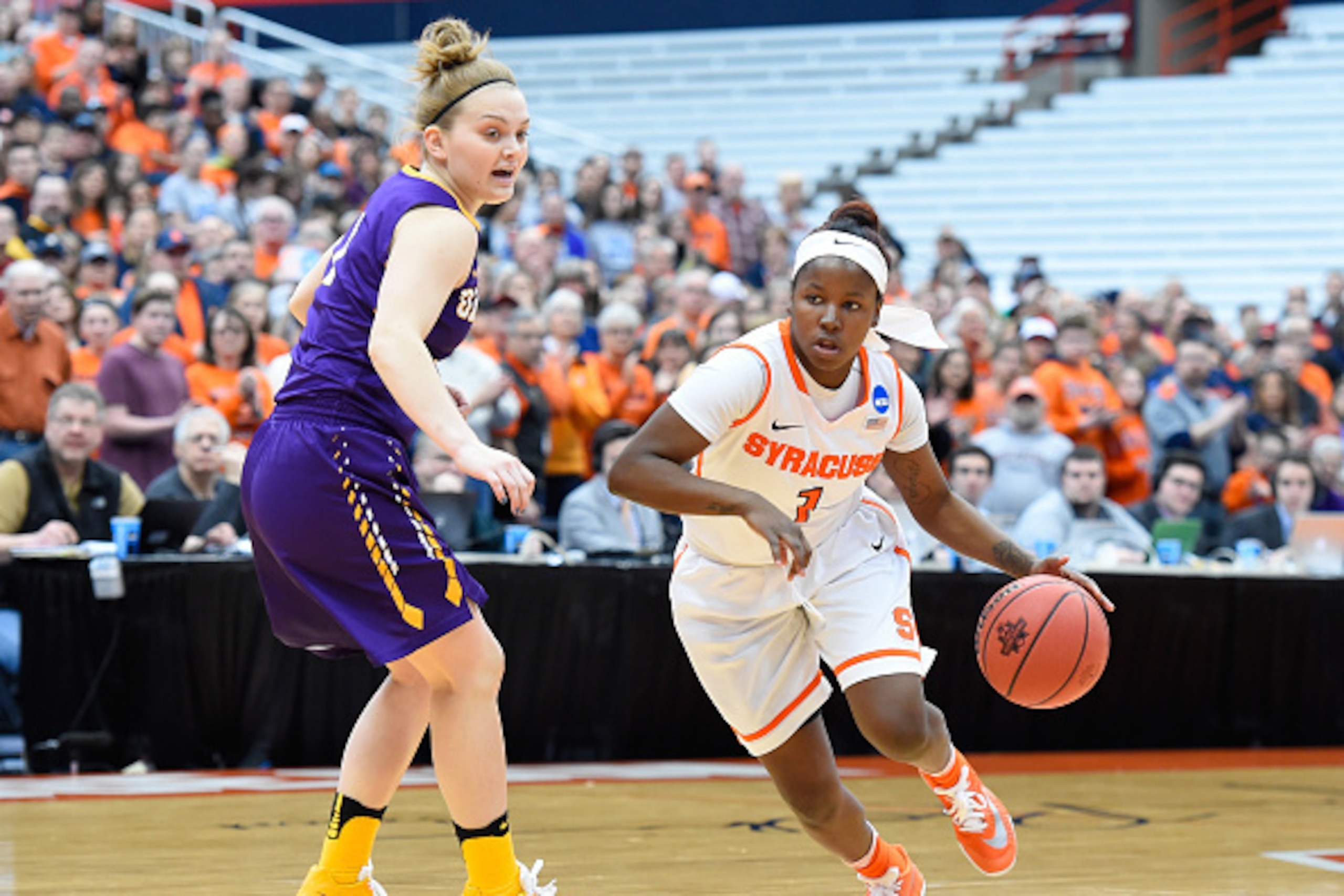 SYRACUSE, NY - MARCH 20: Alexis Peterson #1 of the Syracuse Orange drives to the basket as Erin Coughlin #1 of the Albany Great Danes defends during the first half in the second round of the 2016 NCAA Women's Basketball Tournament at the Carrier Dome on SYRACUSE, NY - MARCH 20: Alexis Peterson #1 of the Syracuse Orange drives to the basket as Erin Coughlin #1 of the Albany Great Danes defends during the first half in the second round of the 2016 NCAA Women's Basketball Tournament at the Carrier Dome on