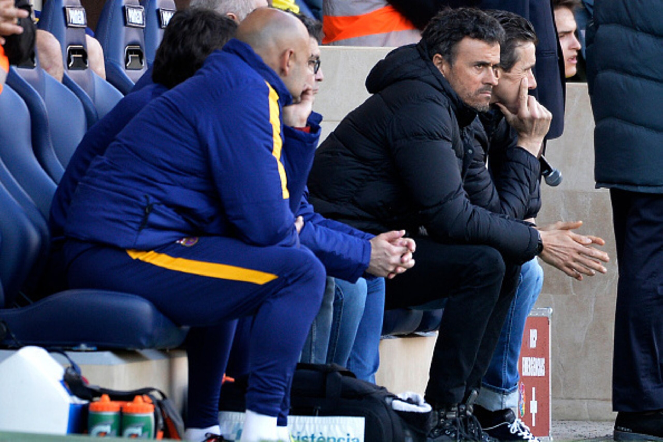 Barcelona's coach Luis Enrique sits on the sidelines during the Spanish league football match Villarreal CF vs FC Barcelona at El Madrigal stadium in Vila-real on March 20, 2016. / AFP / JOSE JORDAN        (Photo credit should read JOSE JORDAN/AFP/Getty I