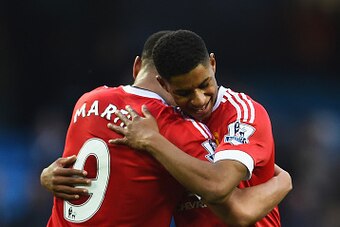 MANCHESTER, ENGLAND - MARCH 20:  Winning goalscorer Marcus Rashford of Manchester United (R) and team mates Anthony Martial (C) and Timothy Fosu-Mensah celebrate victory after the Barclays Premier League match between Manchester City and Manchester United